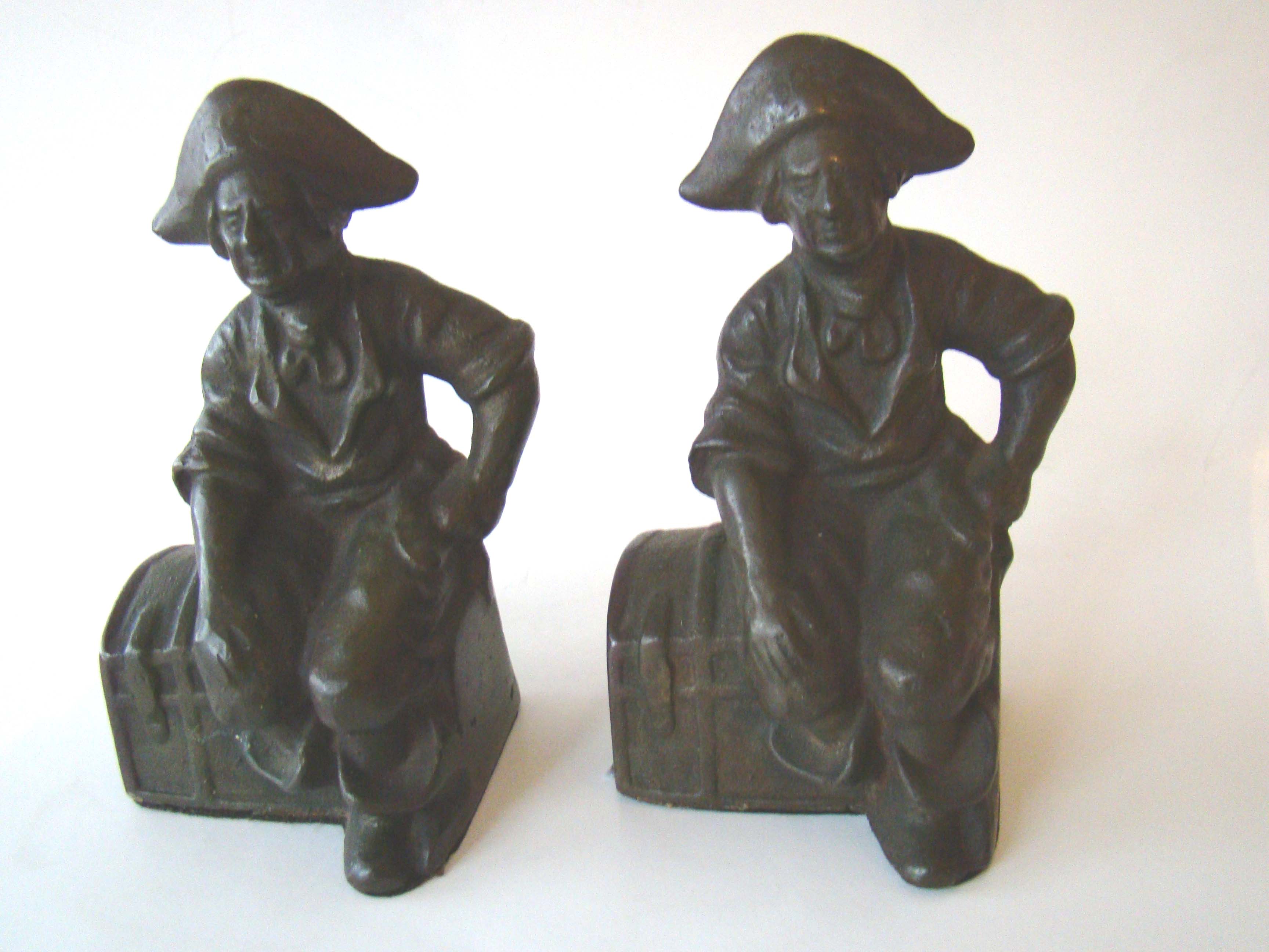 A charming pair of antique bookends depicting a pirate sitting on a treasure chest circa 1910-1920