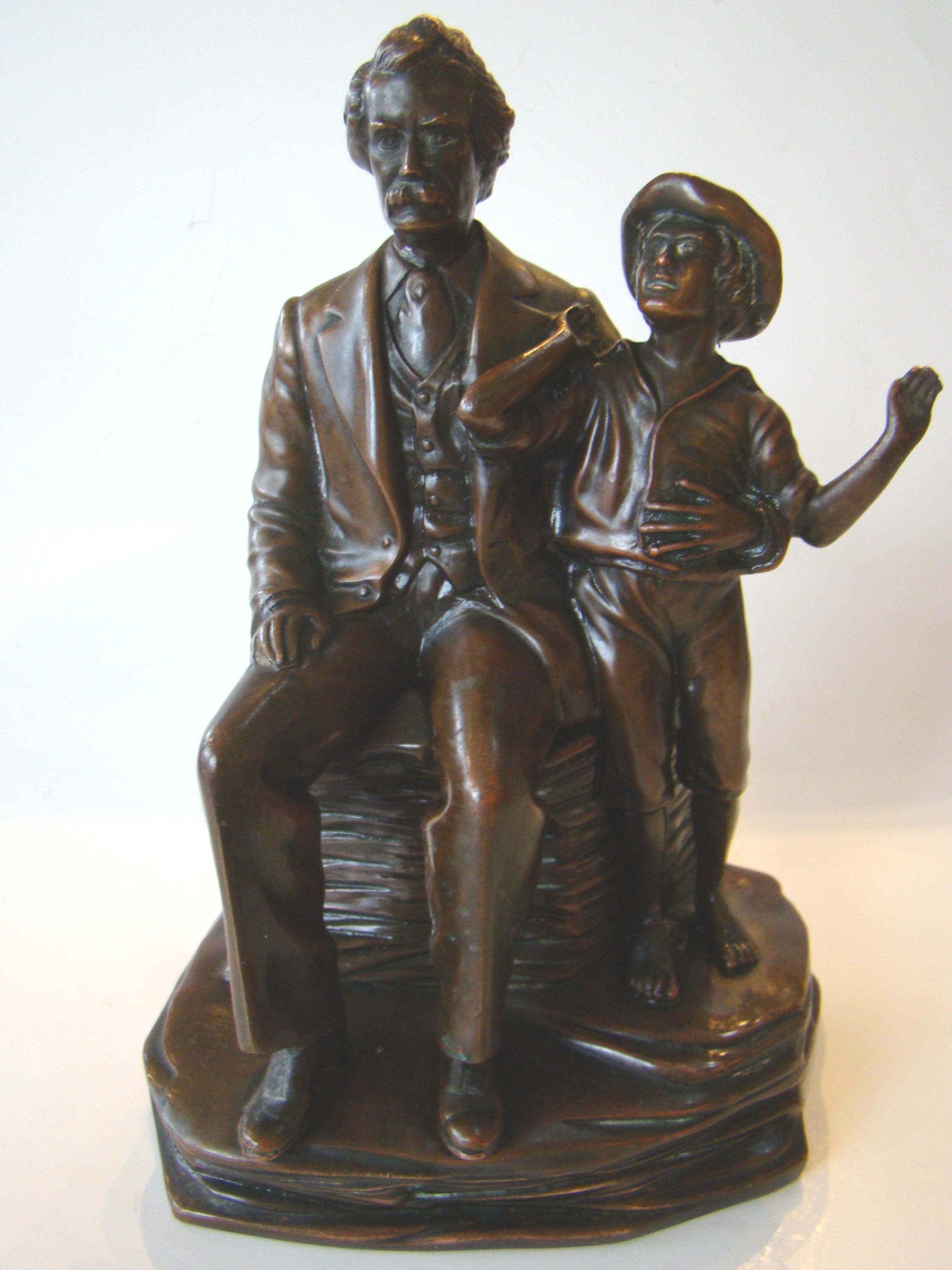 One of the most sought after and charming antique bookends ever made depicting Mark Twain and Tom Sawyer