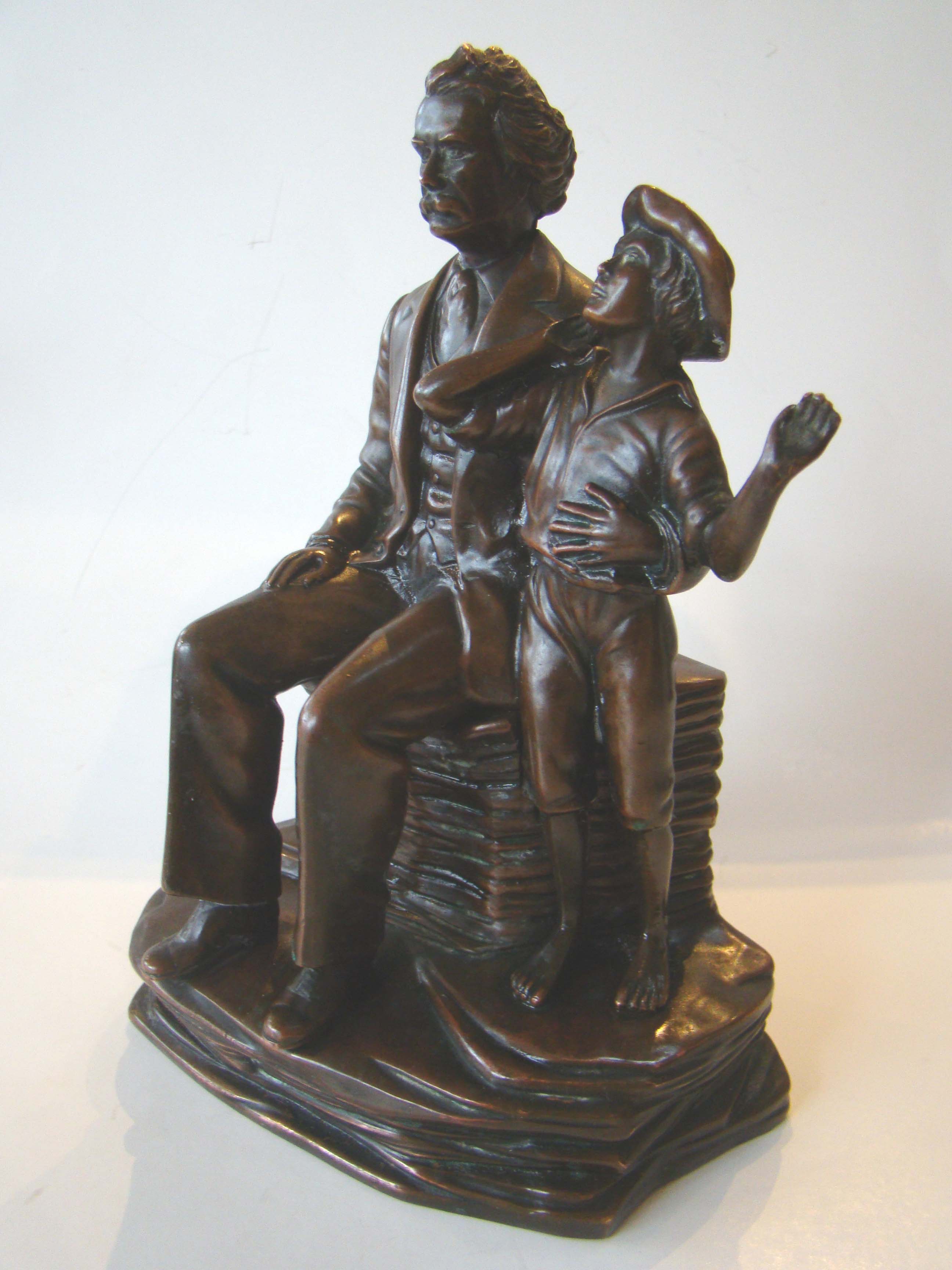 One of the most sought after and charming antique bookends ever made depicting Mark Twain and Tom Sawyer — image 2