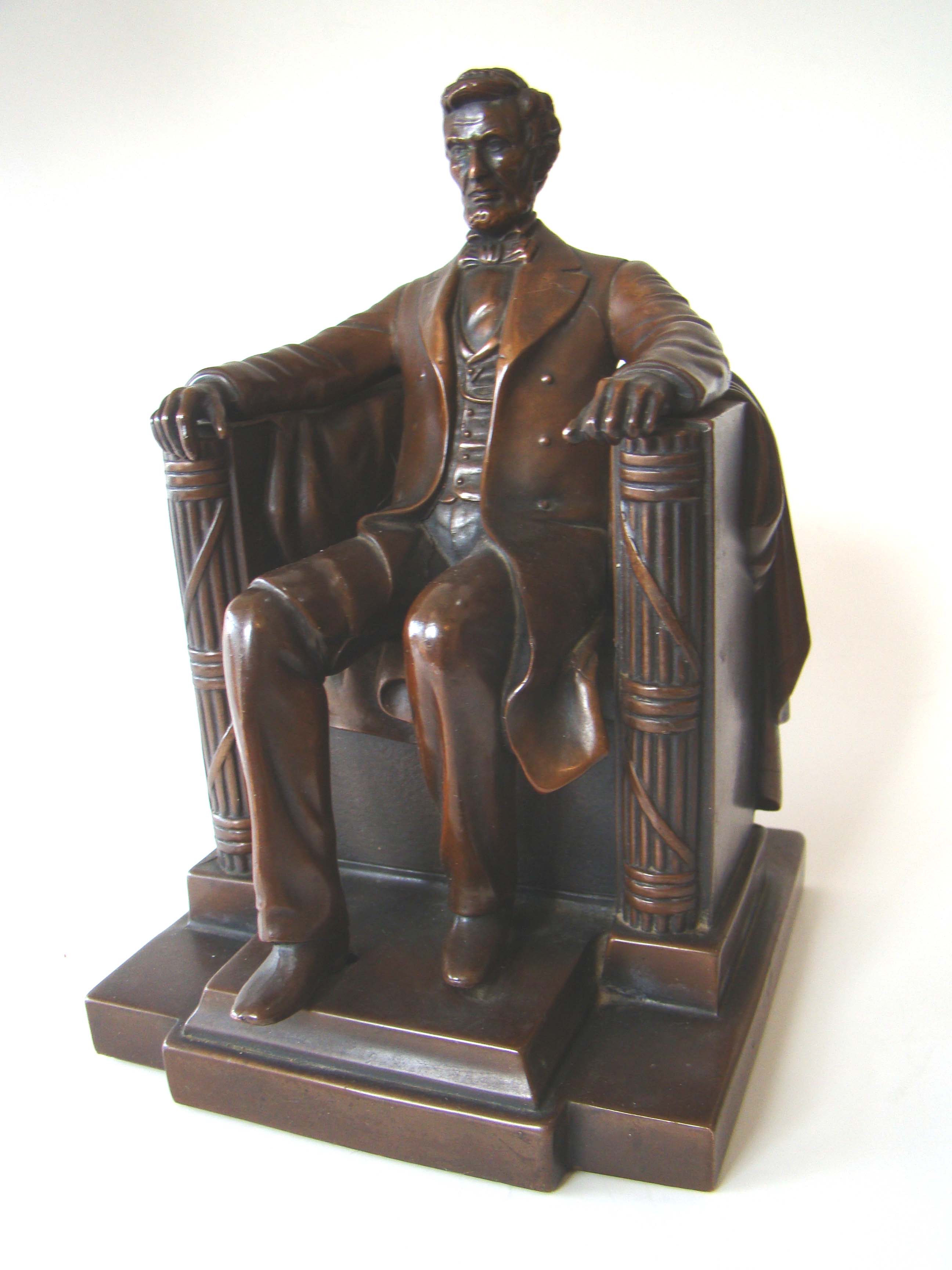 A single "Lincoln in the chair" chocolate brown bronze bookend by Jennings Brothers circa 1925