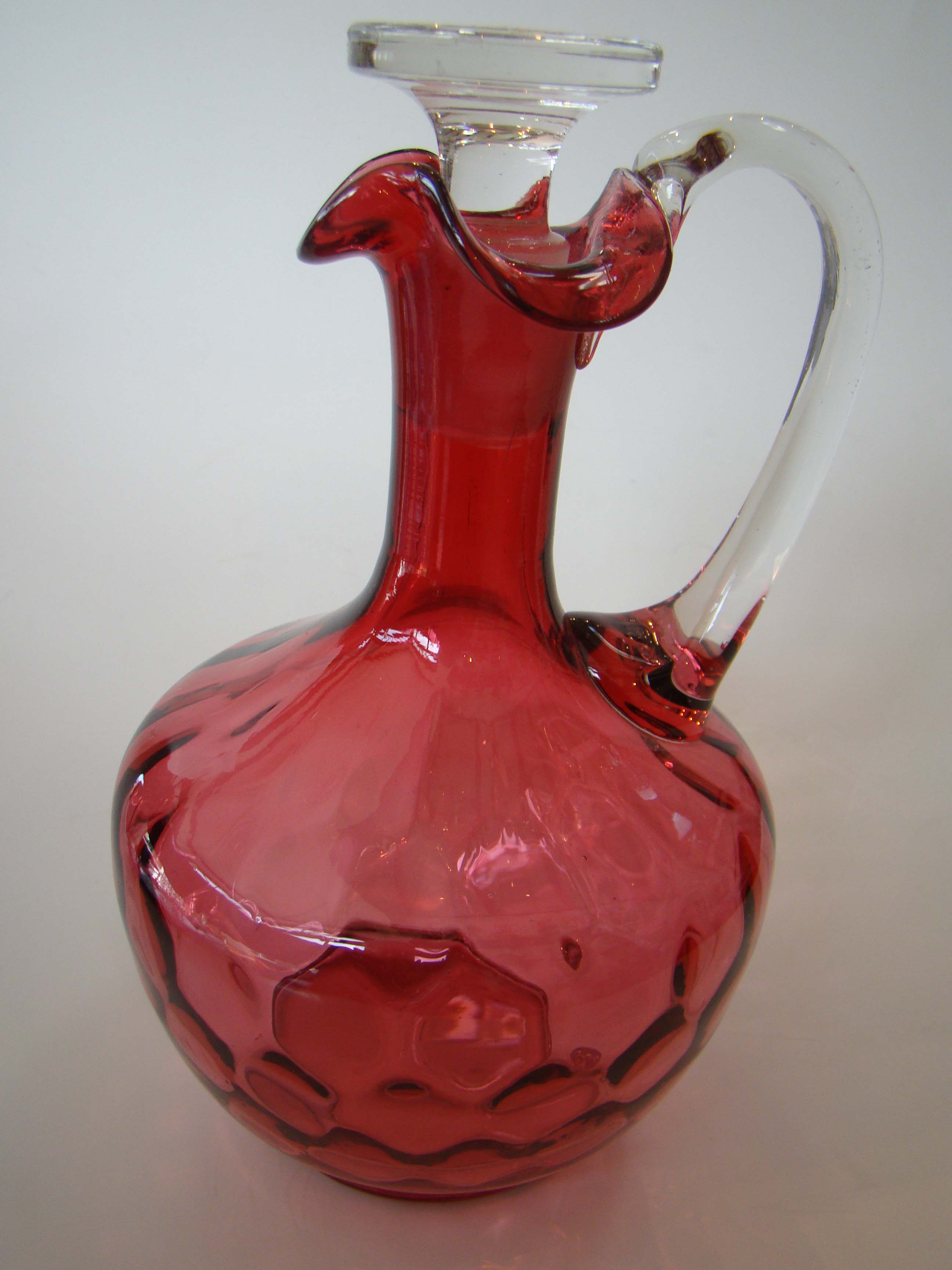 A beautiful vintage cranberry glass decanter