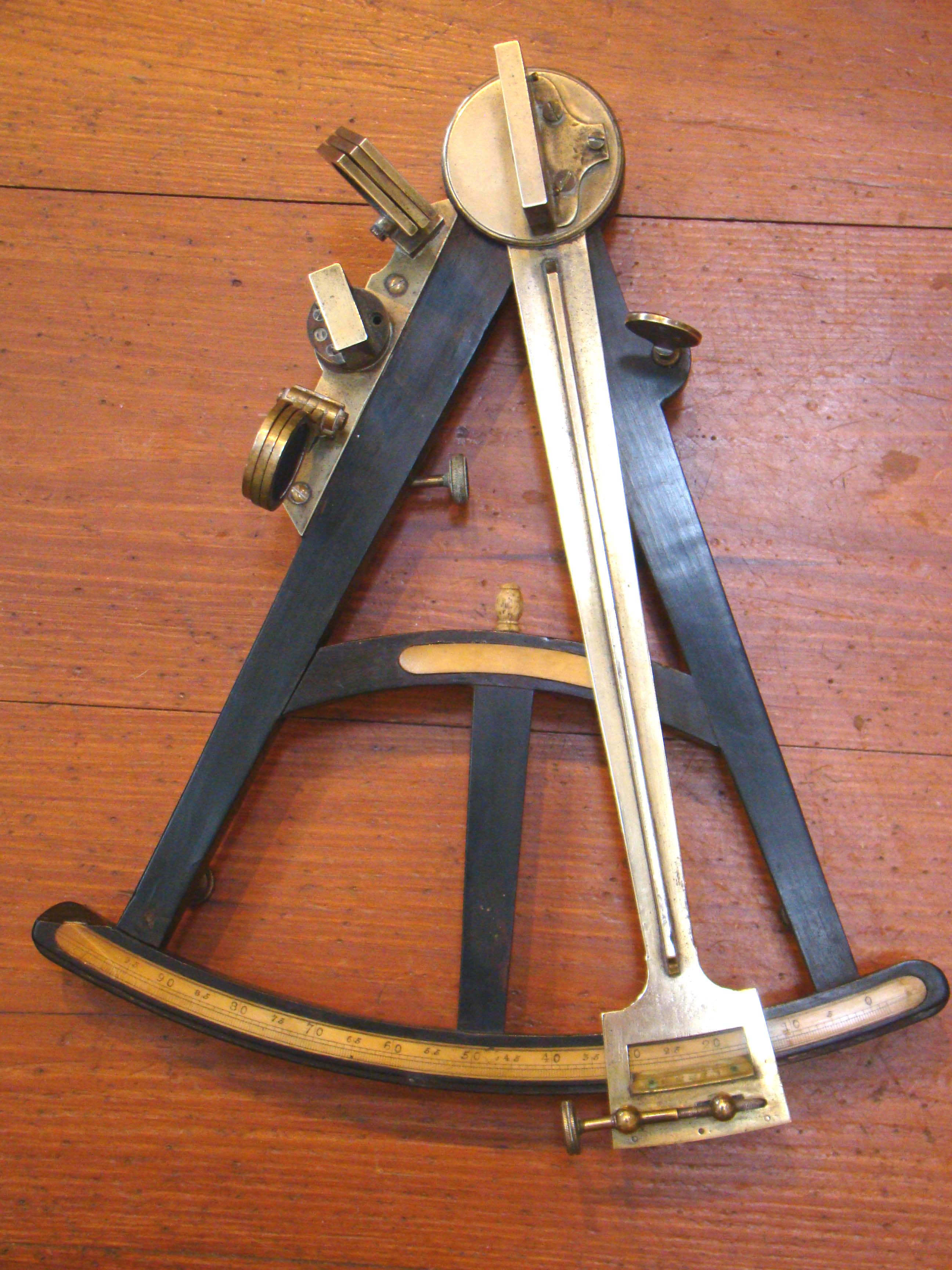 A fine Mariner's ebony framed octant with its' original stepped oak case circa 1800-1820 sold by Frederick W. Lincoln of Boston circa 1840-1850