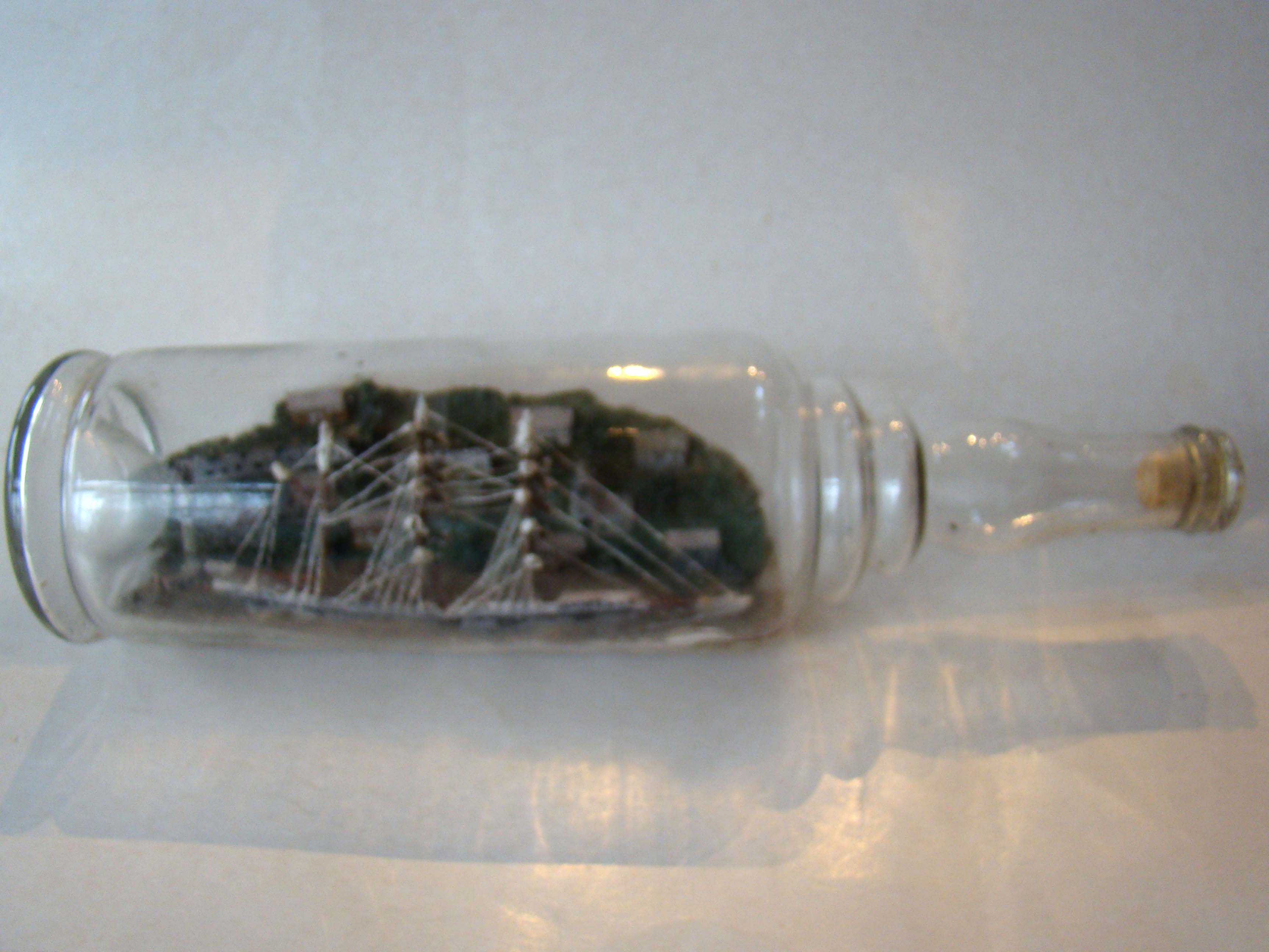 A very early fully rigged three-masted ship in-a bottle circa 1880-1890