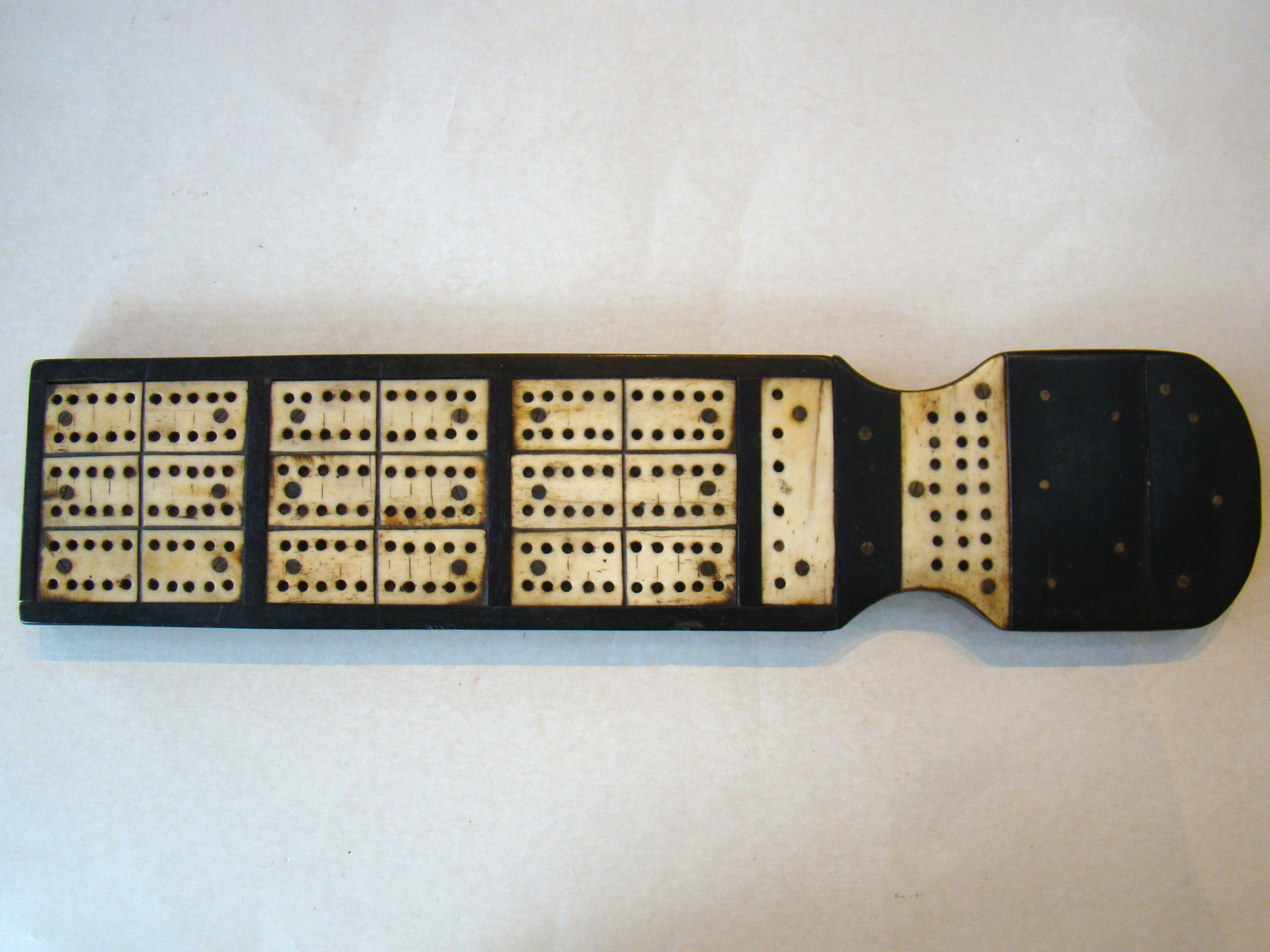 A rare 19th century sailor-made whalebone, baleen, ebony and mahogany game board