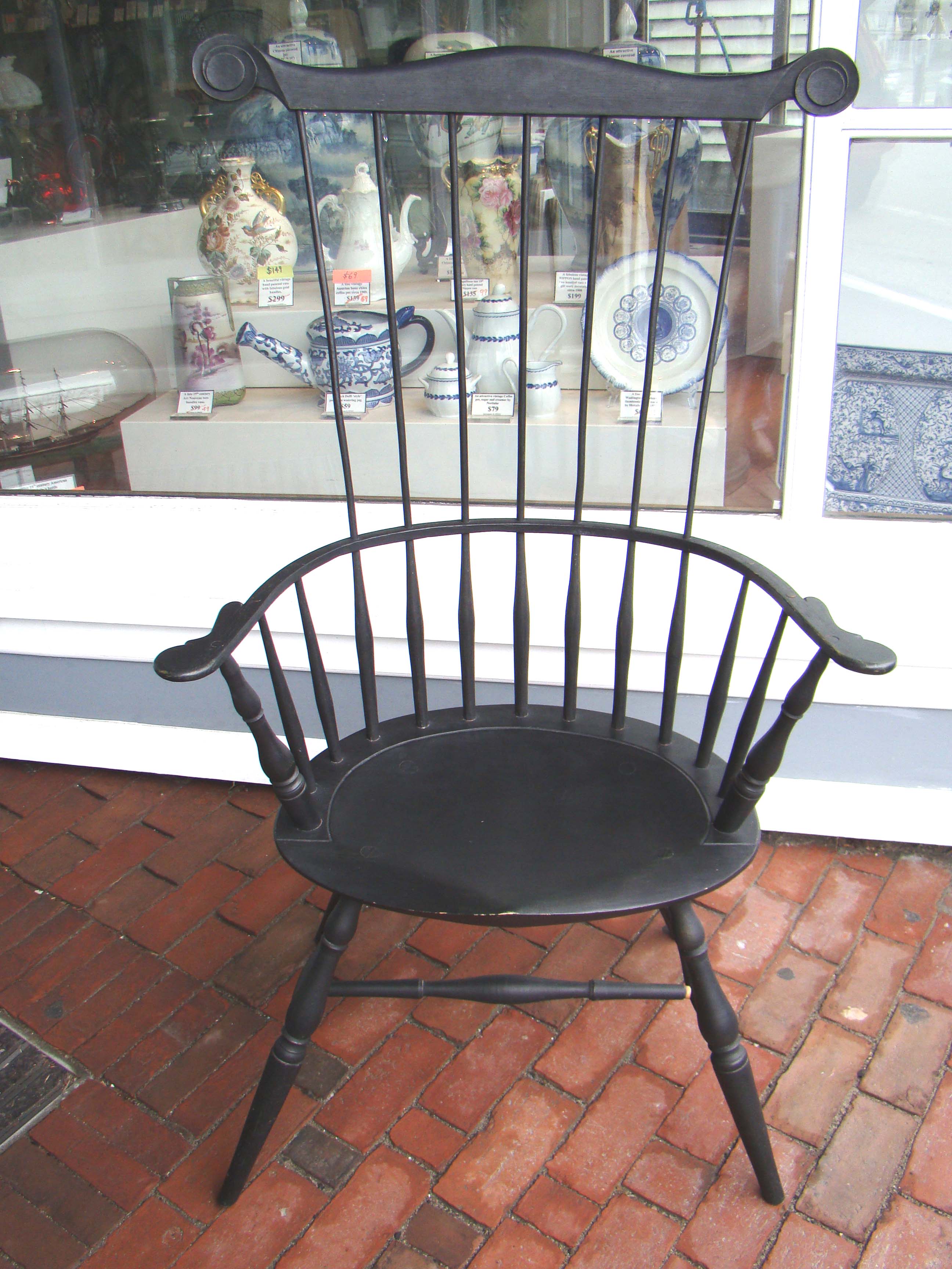 An 18th century 'style' comb back armchair signed by the maker and dated 1992