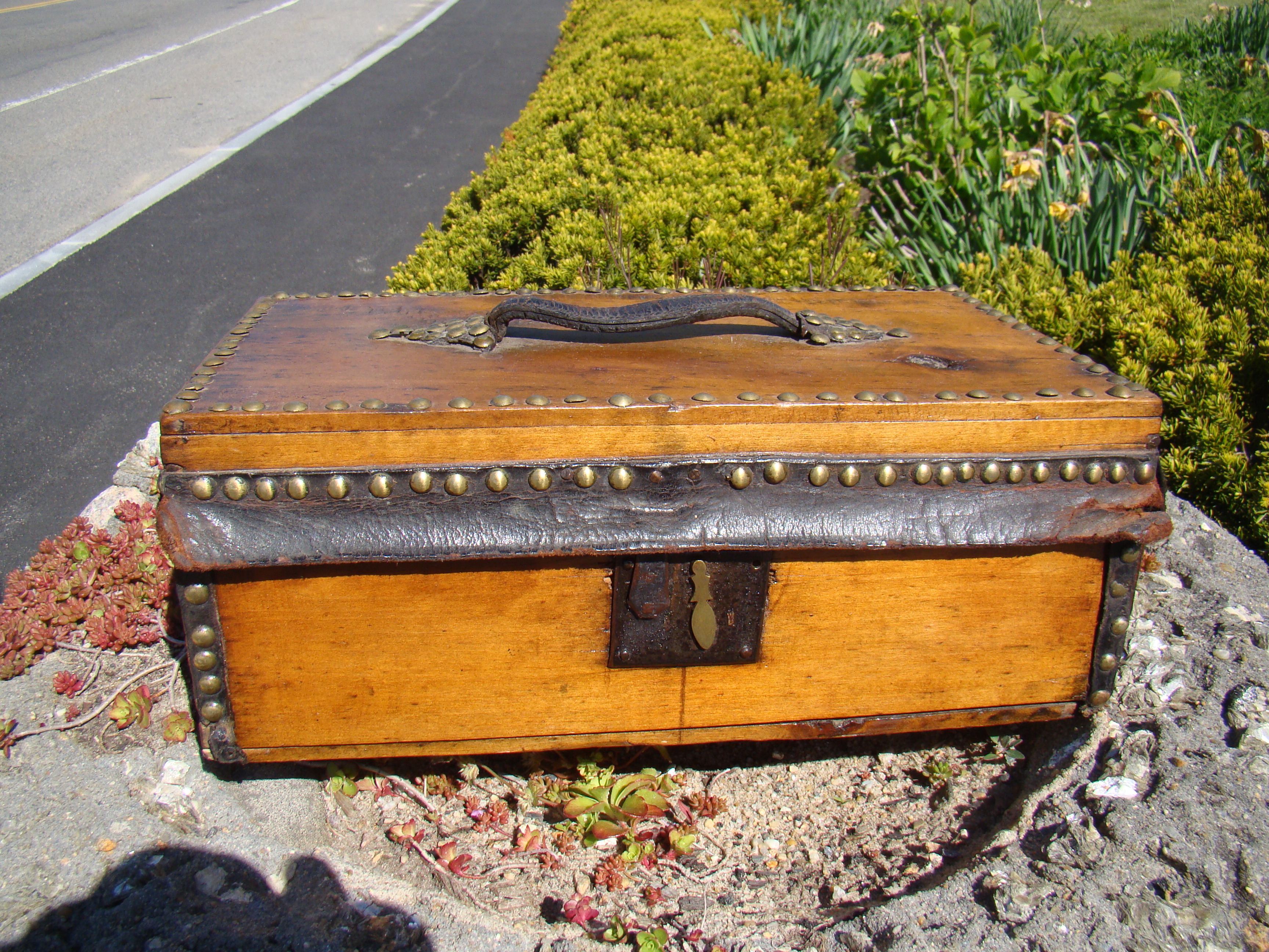 A brass studded travelling trunk made by Asa Morrill of Concord, N H  circa 1840-1843