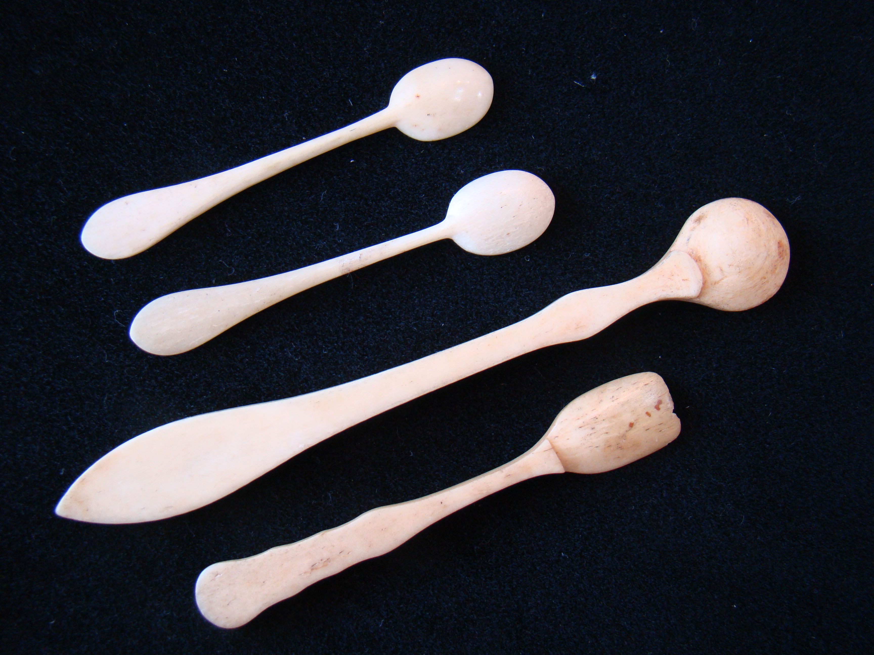 A group of four 19th century whalebone spoons