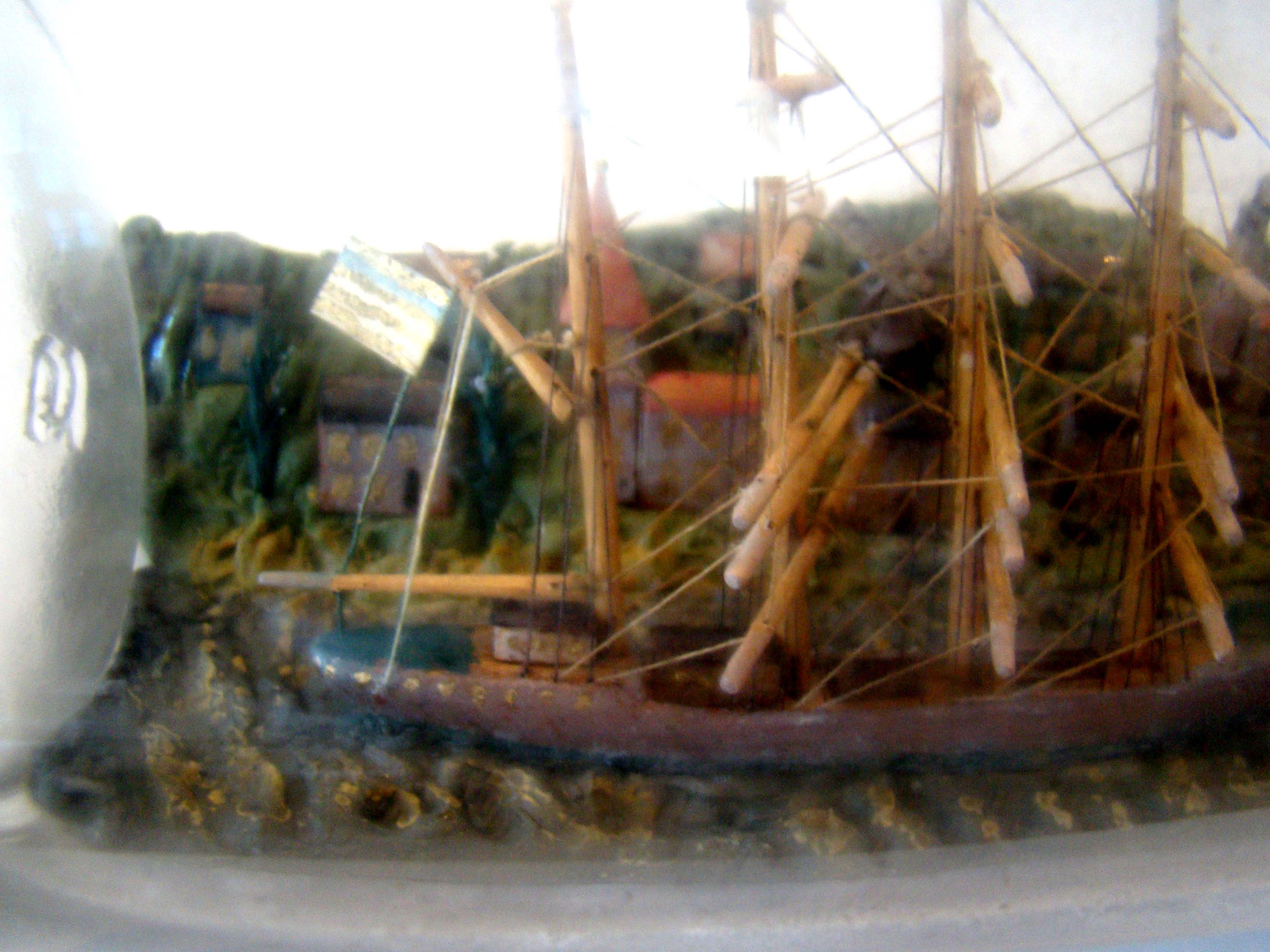 A wonderful vintage ship-in-a bottle circa 1890-1910 with elaborate and detailed village in the background. — image 2