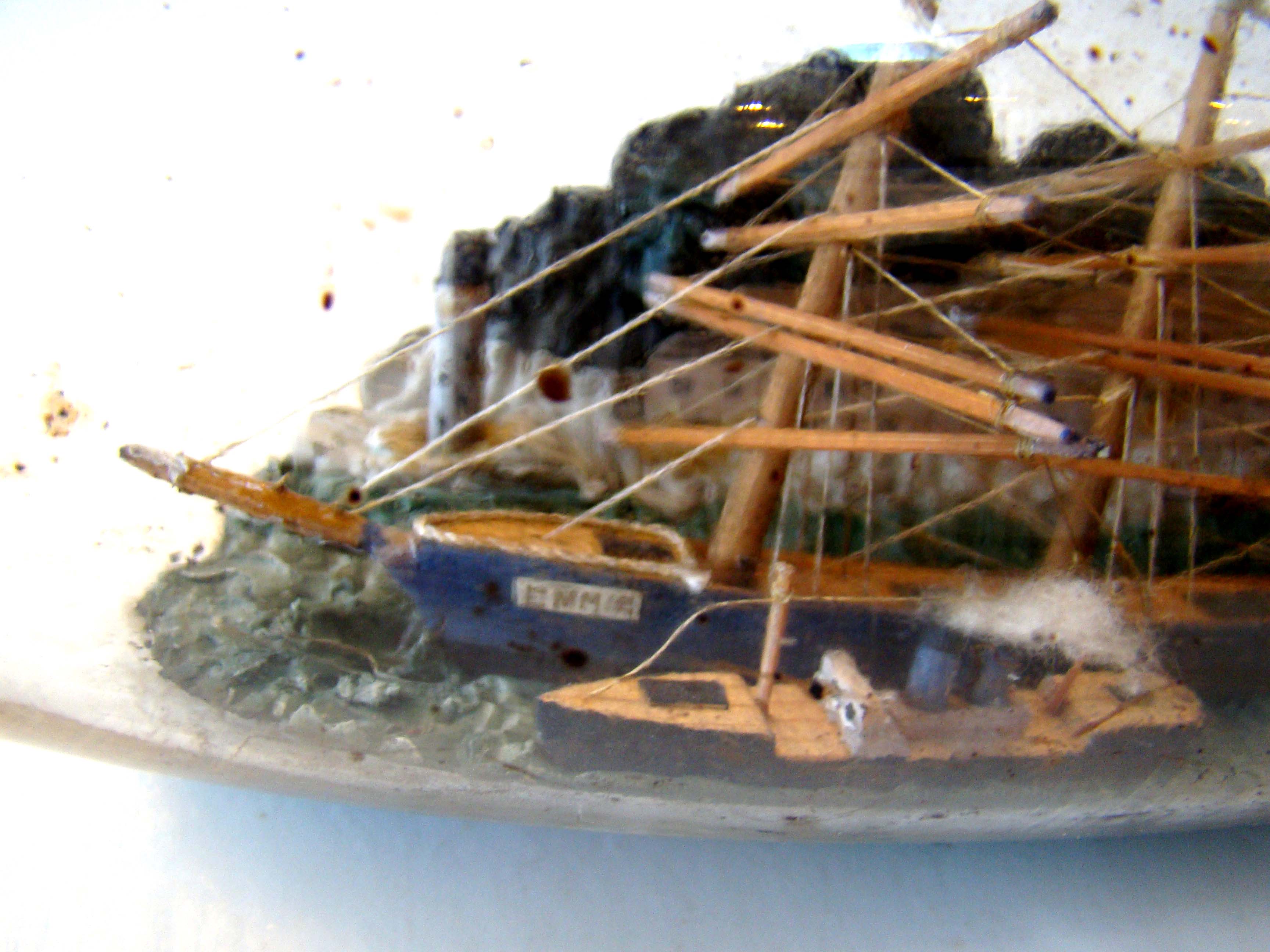 A fine vintage four-masted ship-in-a bottle circa 1910-1920 with two smaller ships in the foreground. — image 2