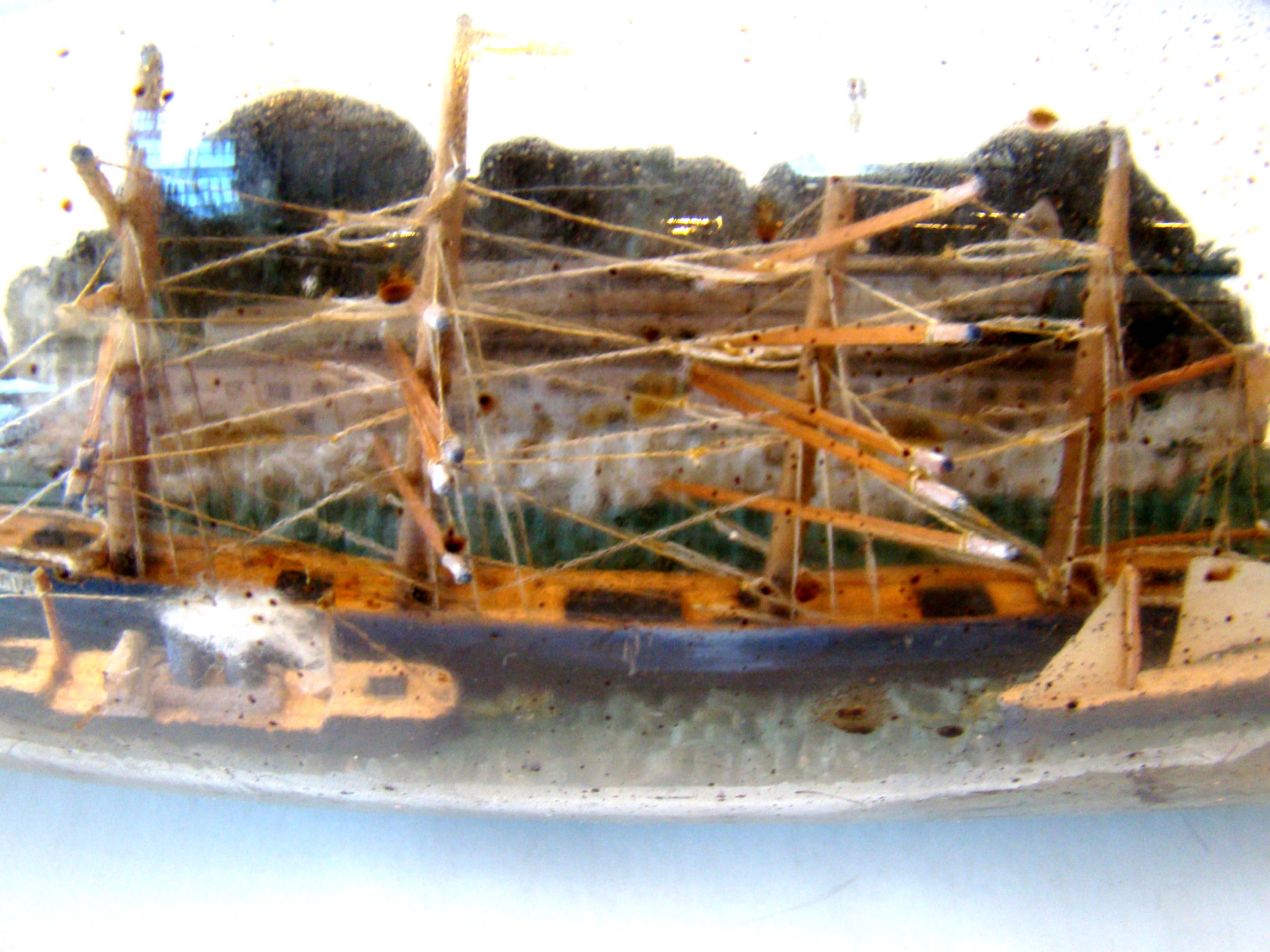 A fine vintage four-masted ship-in-a bottle circa 1910-1920 with two smaller ships in the foreground. — image 5