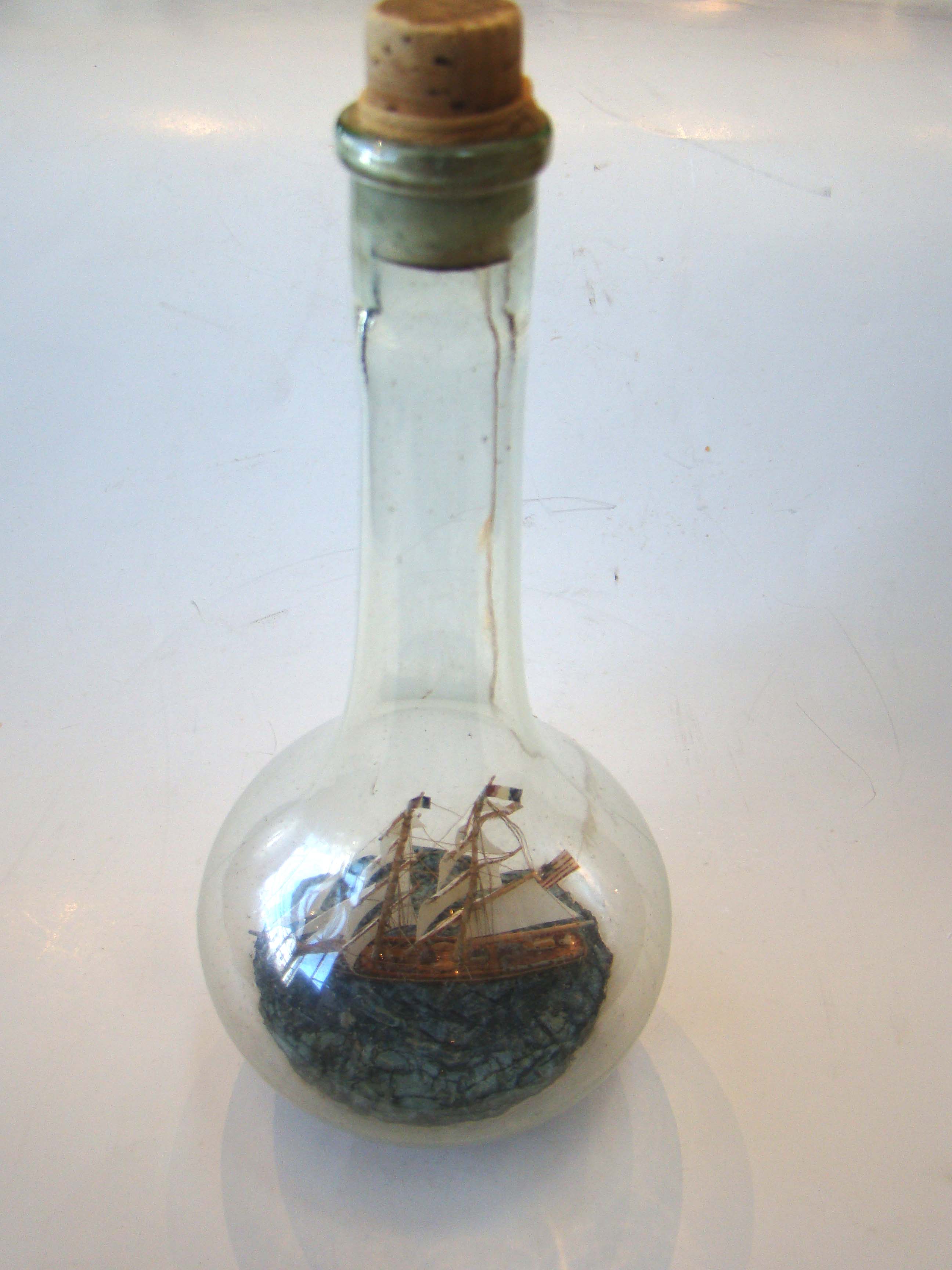 A rare vintage ship in a vertical bottle flying an American flag circa 1940-1950