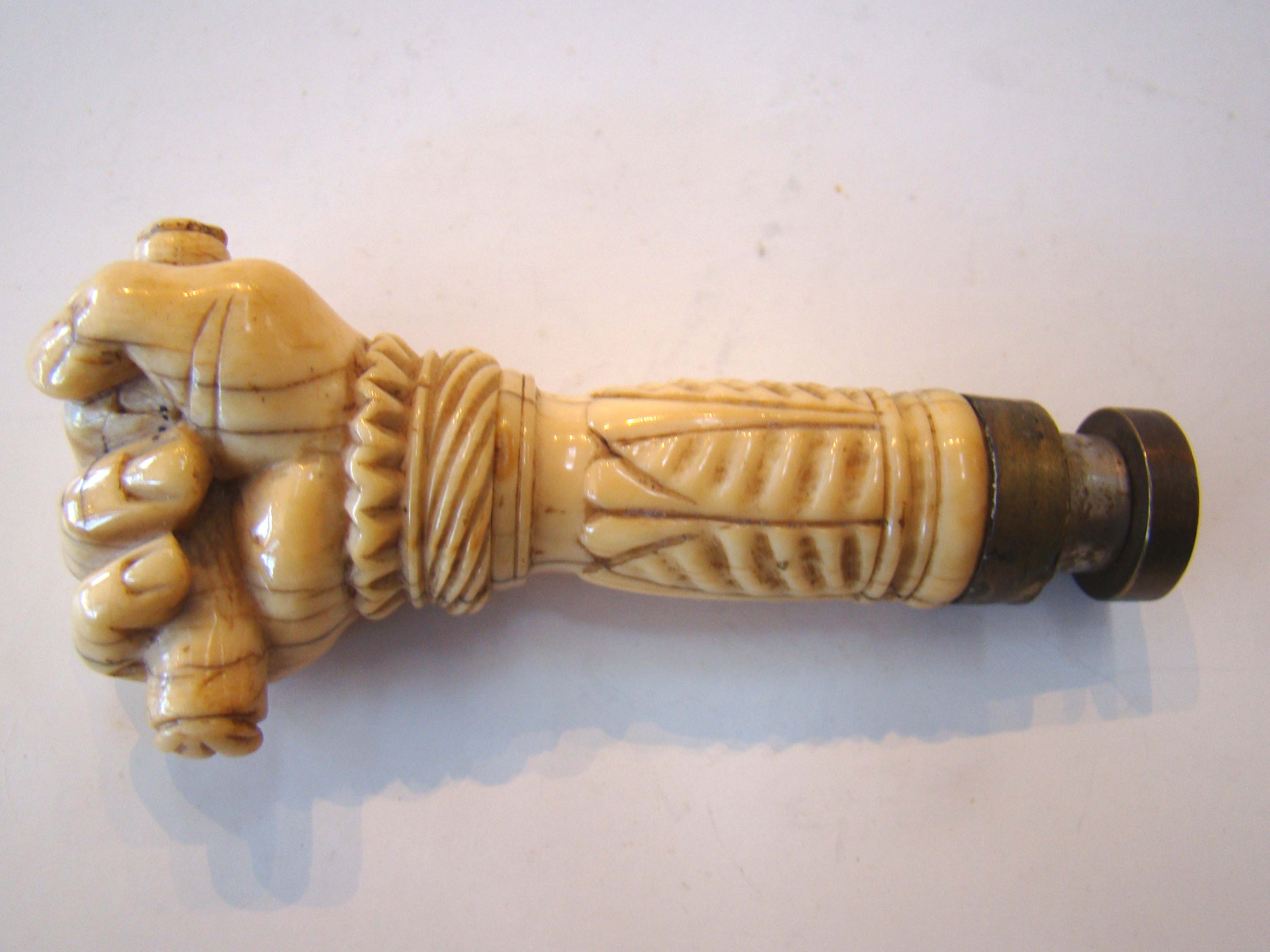 A fine and RARE 19th century sailor carved whale ivory desk seal in the form of a clenched fist