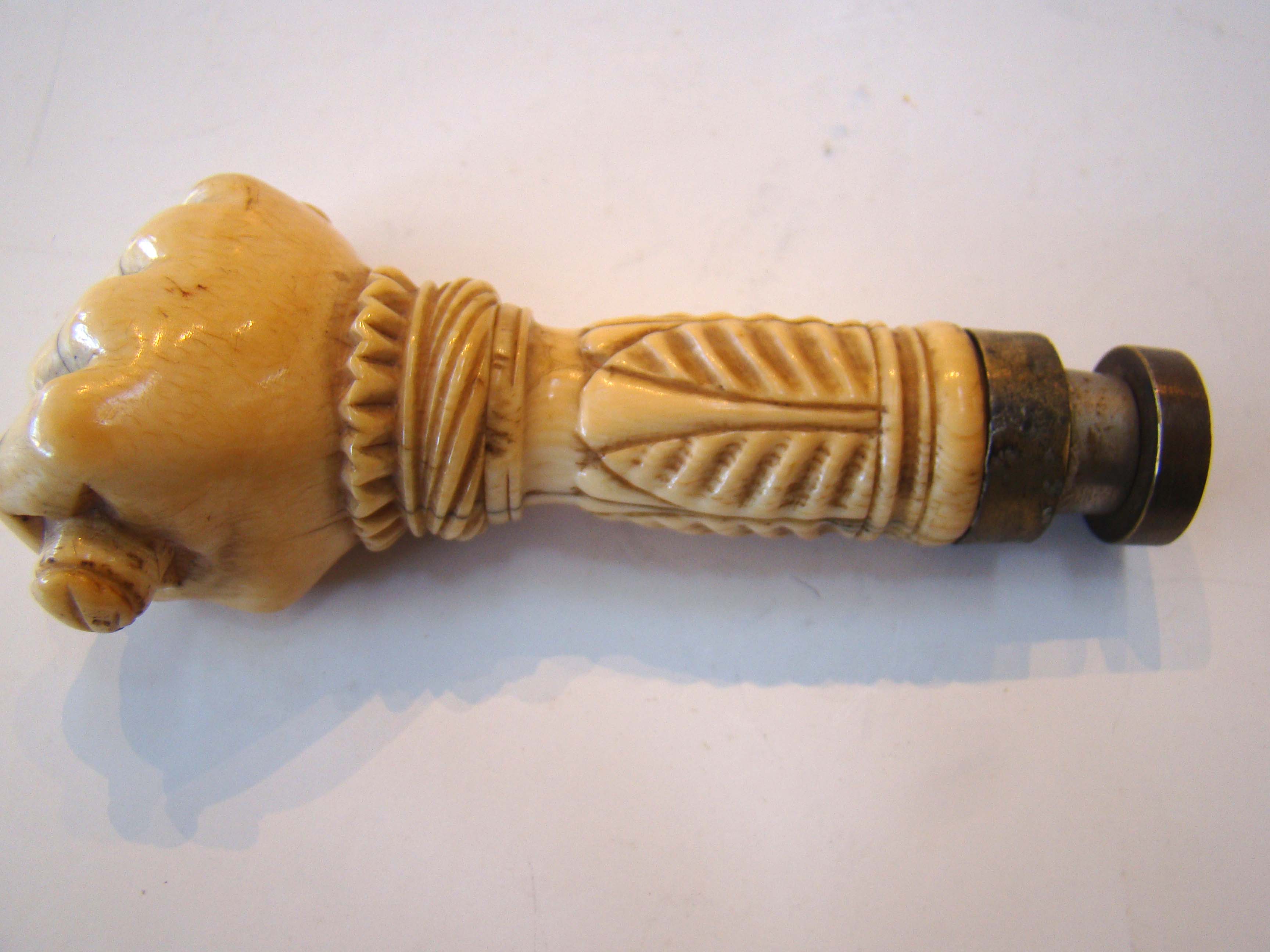 A fine and RARE 19th century sailor carved whale ivory desk seal in the form of a clenched fist — image 2