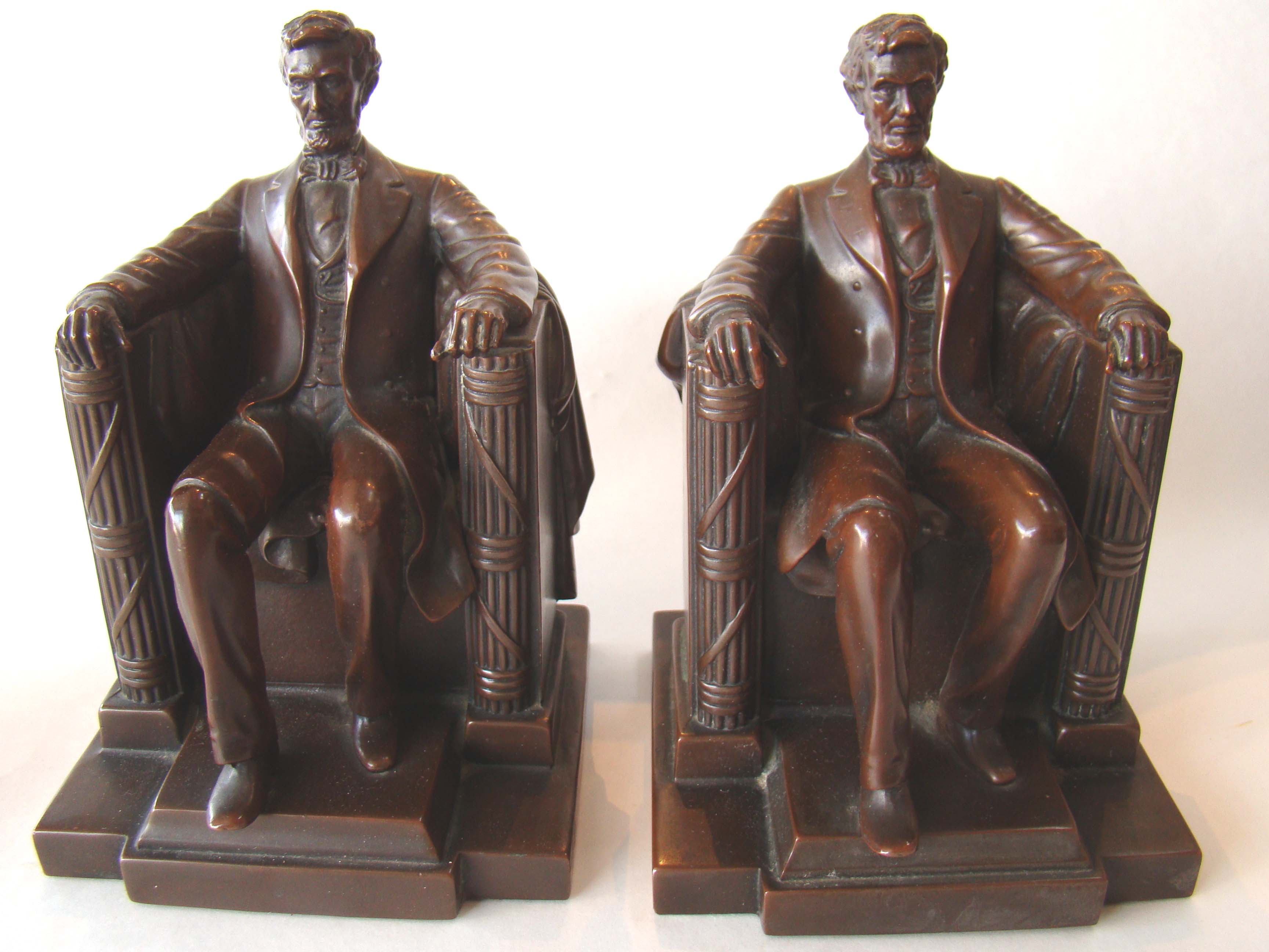 A fabulous pair of chocolate brown bronze finished "LINCOLN in the chair" bookends by Jennings Brothers circa 1925 