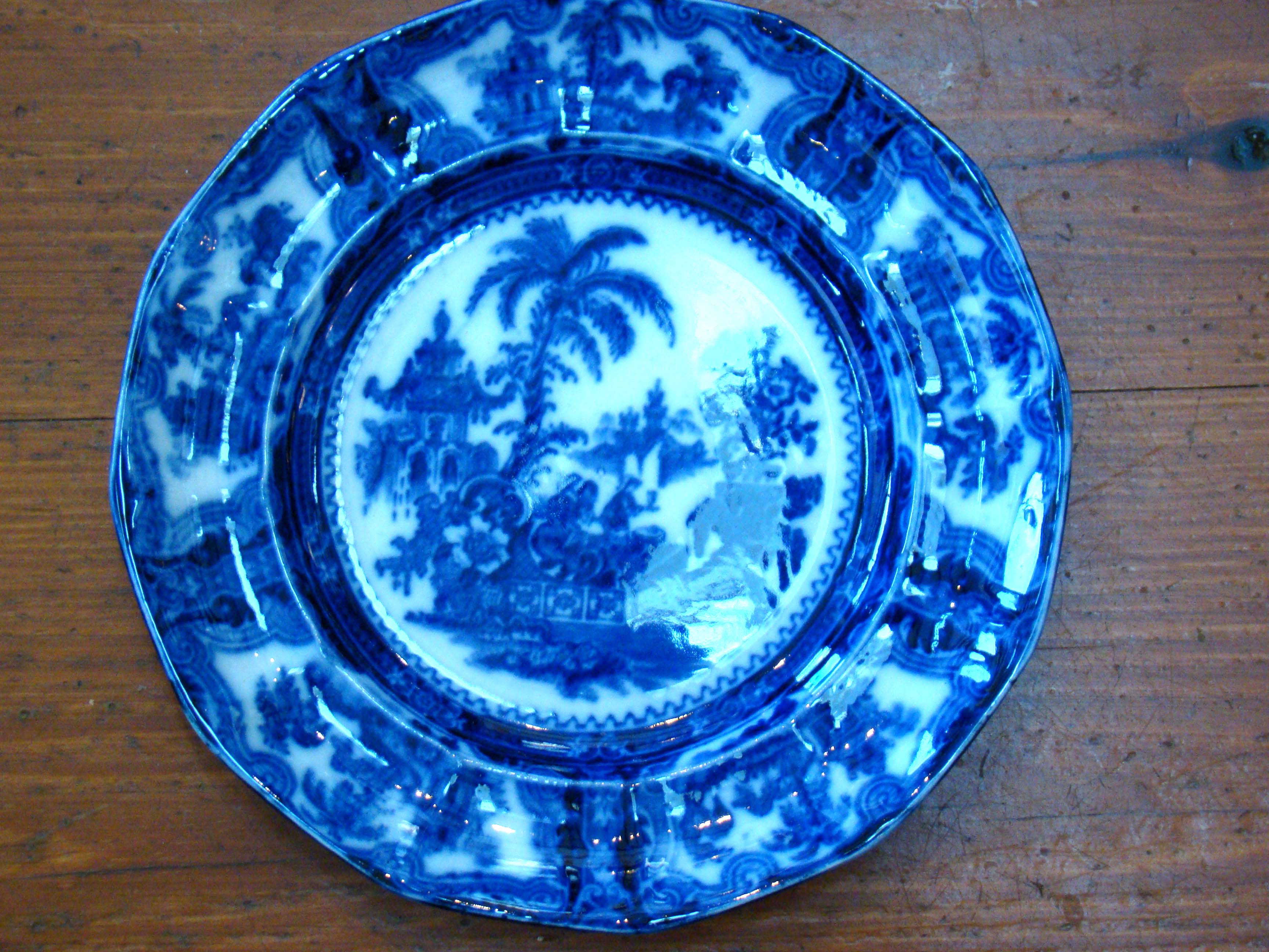 A fine early 19th century FLOW BLUE dinner plate by William Adams circa 1830-1840
