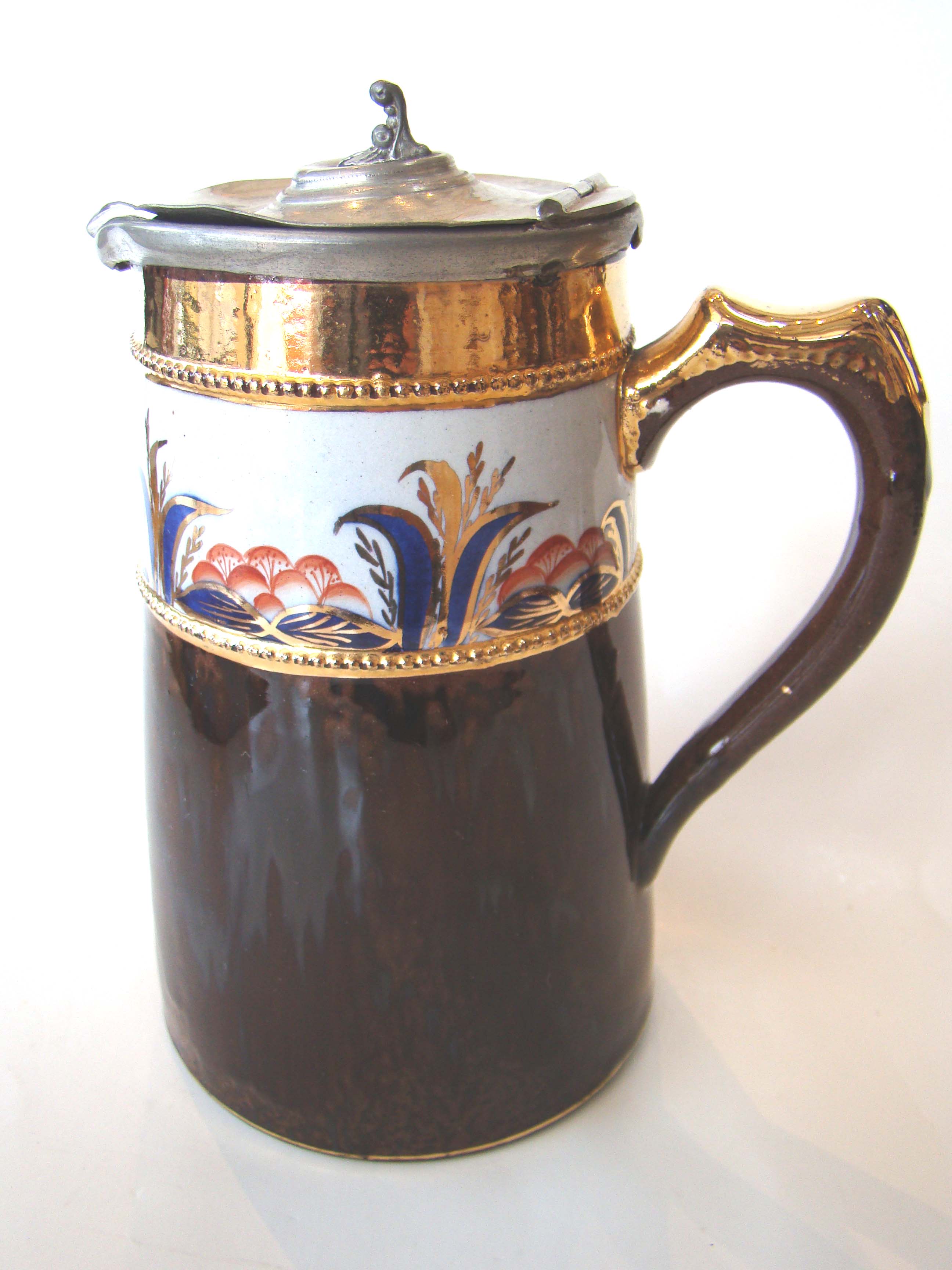 An unusual 19th century pewter lidded tankard
