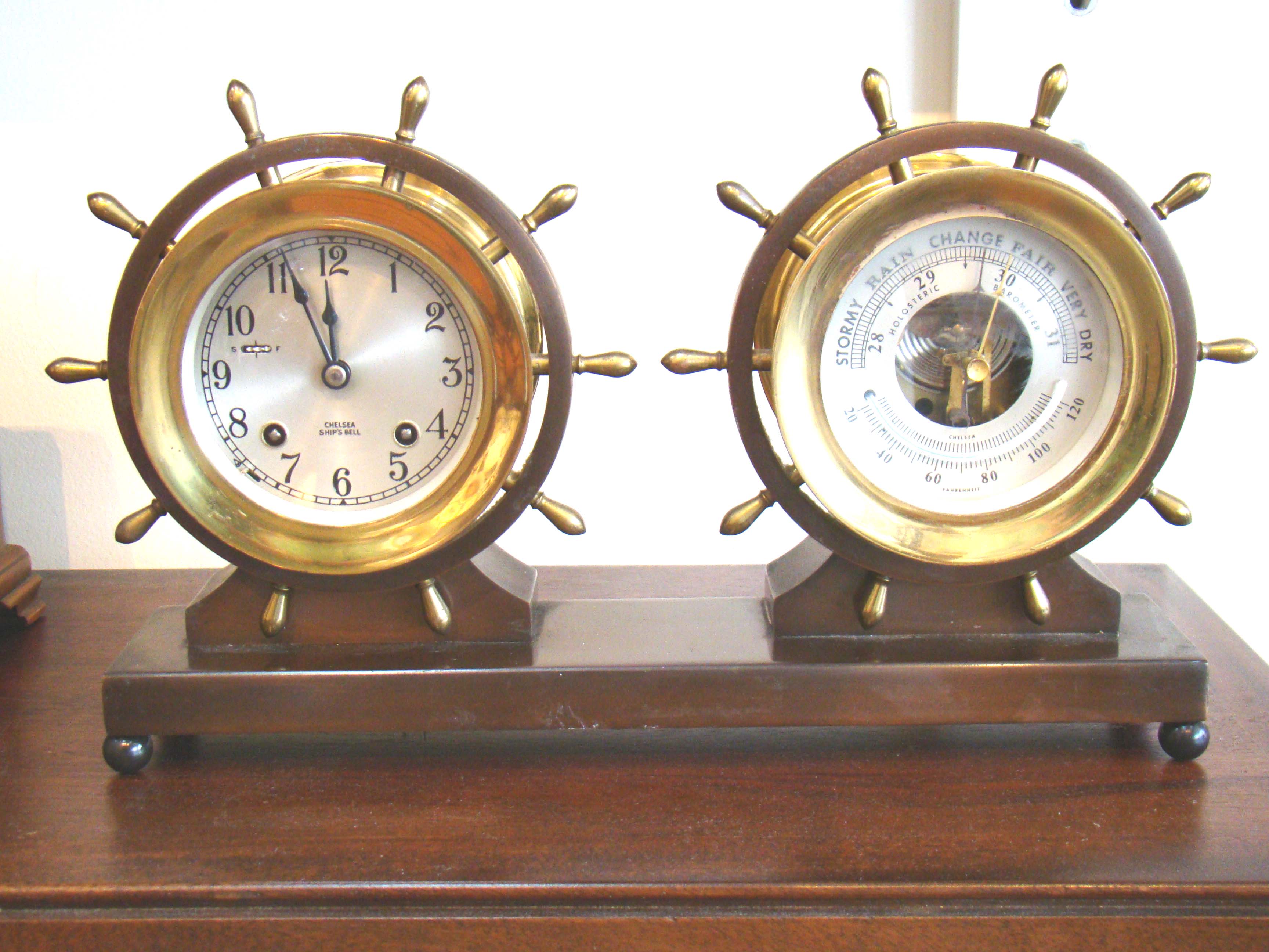 A vintage CHELSEA ships' wheel clock and barometer, "CLAREMONT" model, with eight day movement, made circa 1960