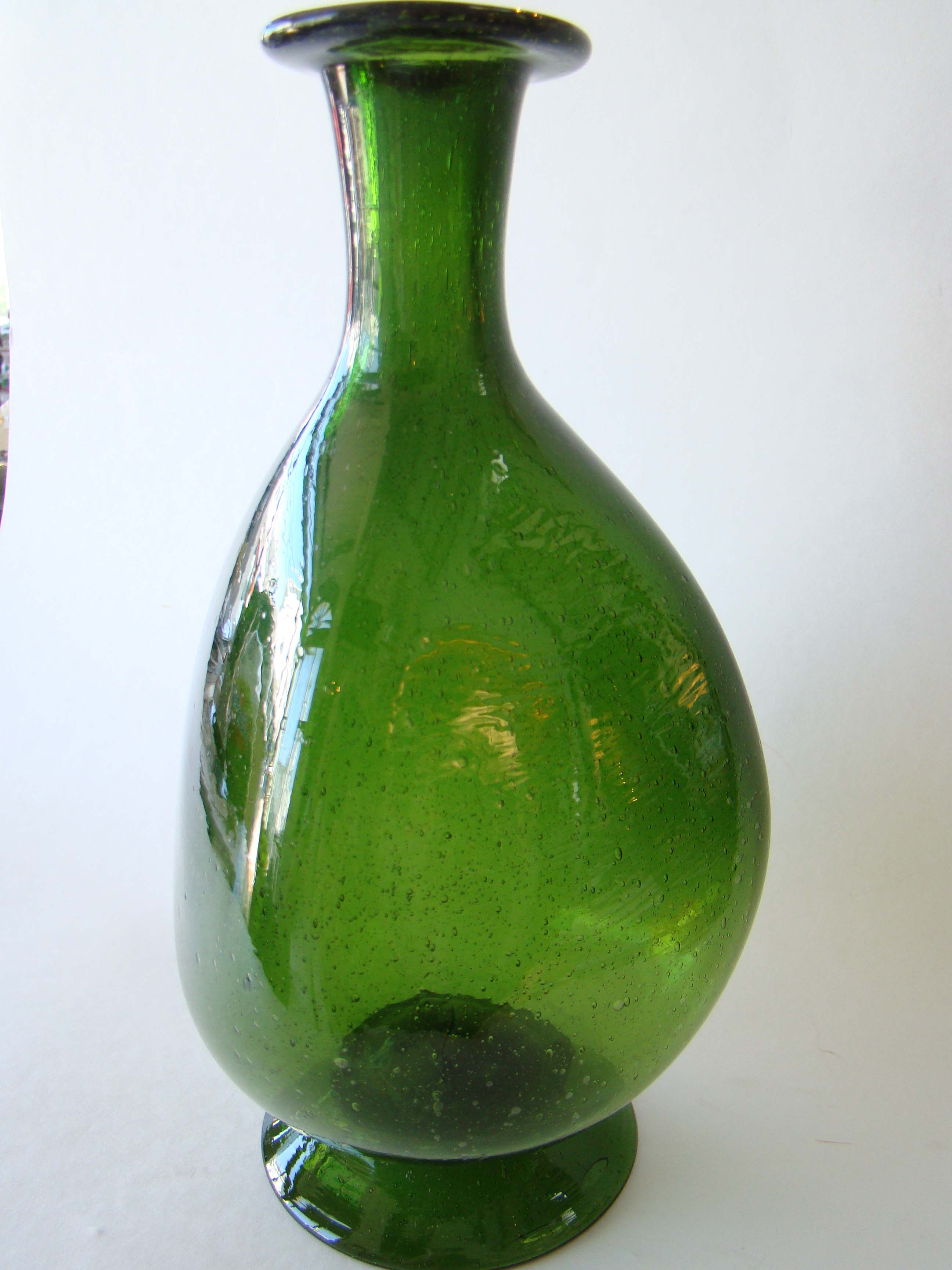 A rare late 18th or early 19th century hand blown green glass decanter