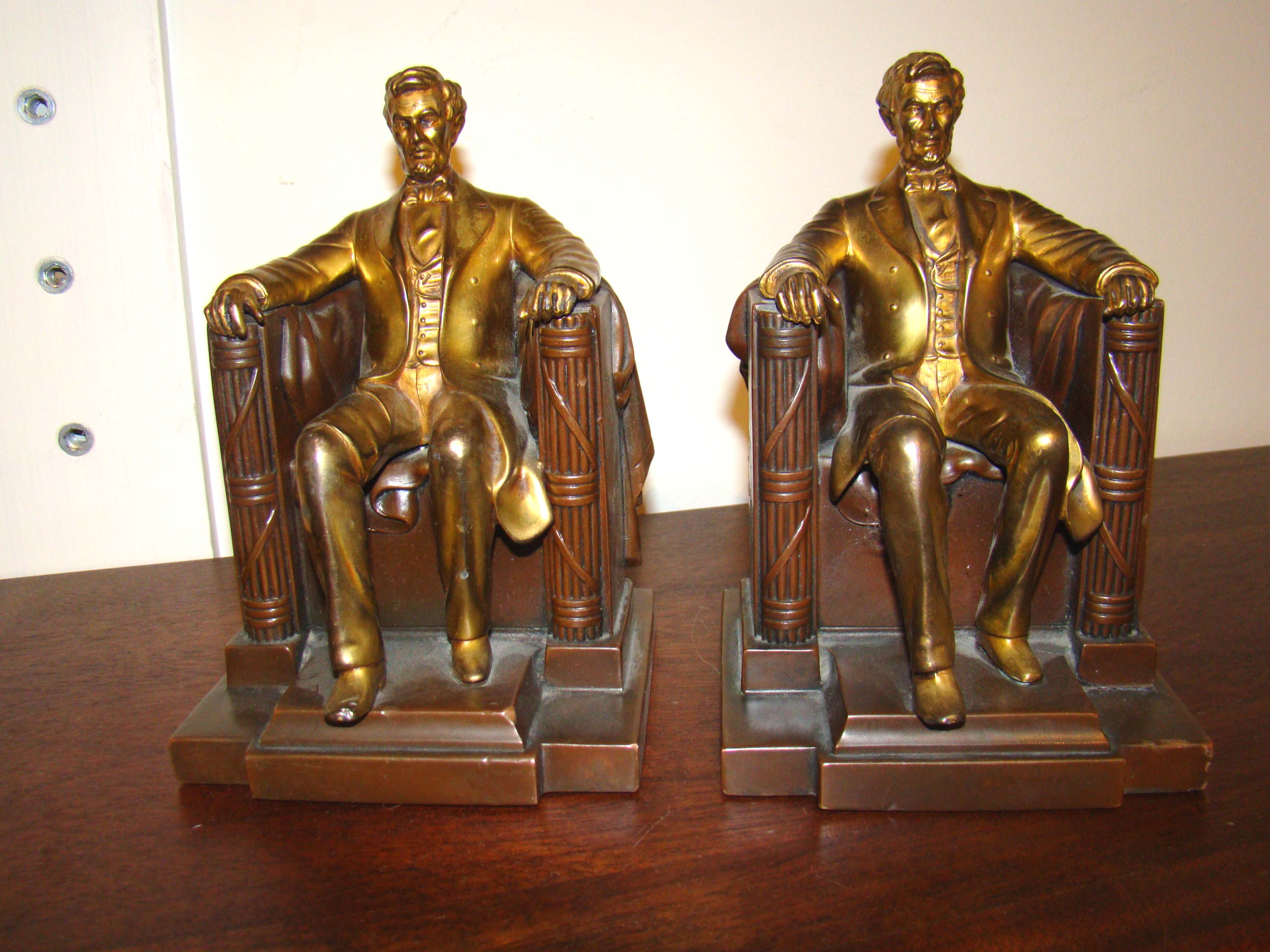 A good pair of vintage 'Lincoln in the chair' bookends made by Jennings Brothers circa 1935