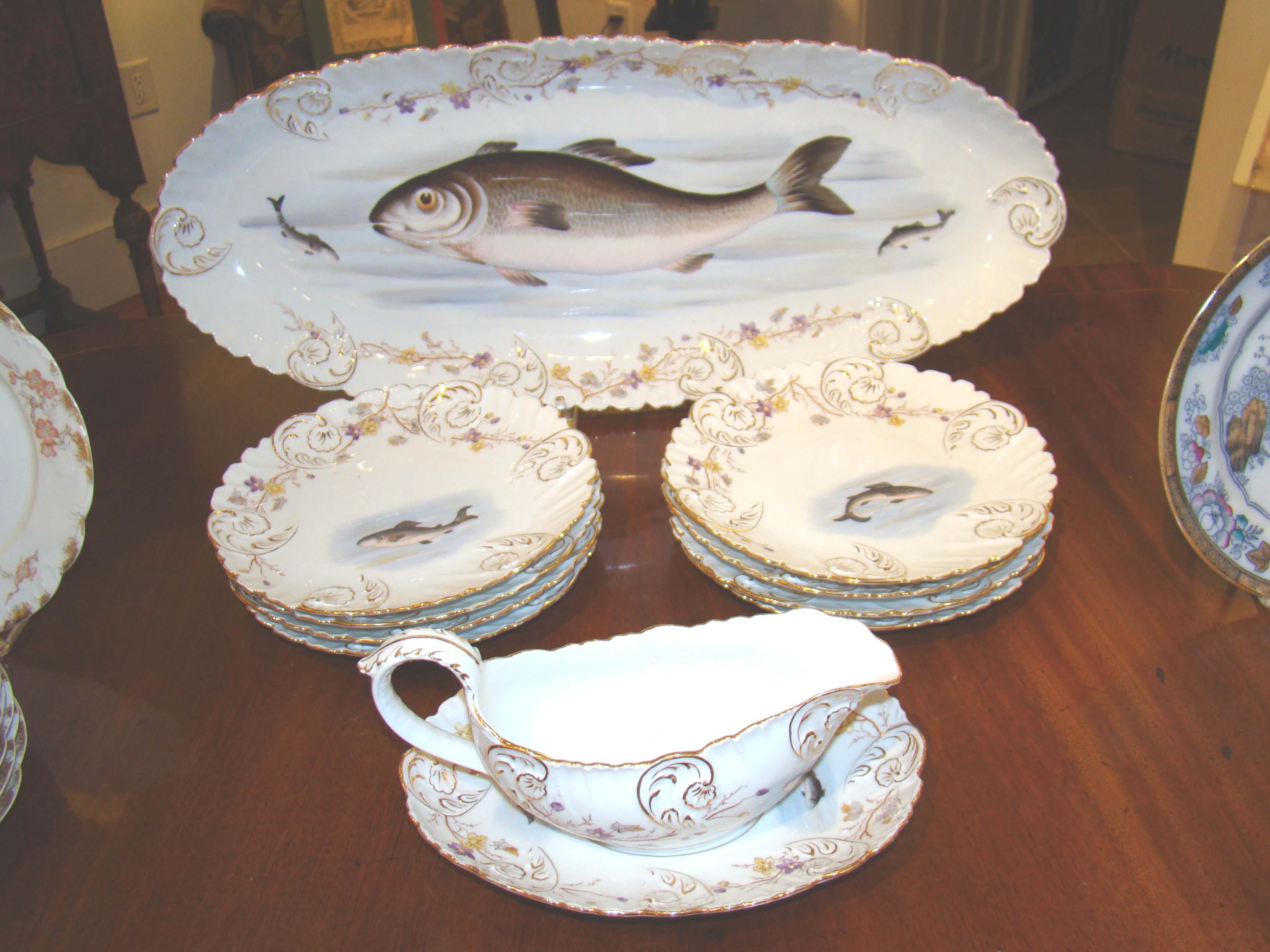 A beautiful hand painted Limoges fish set made by Charles Ahrenfeldt circa 1895