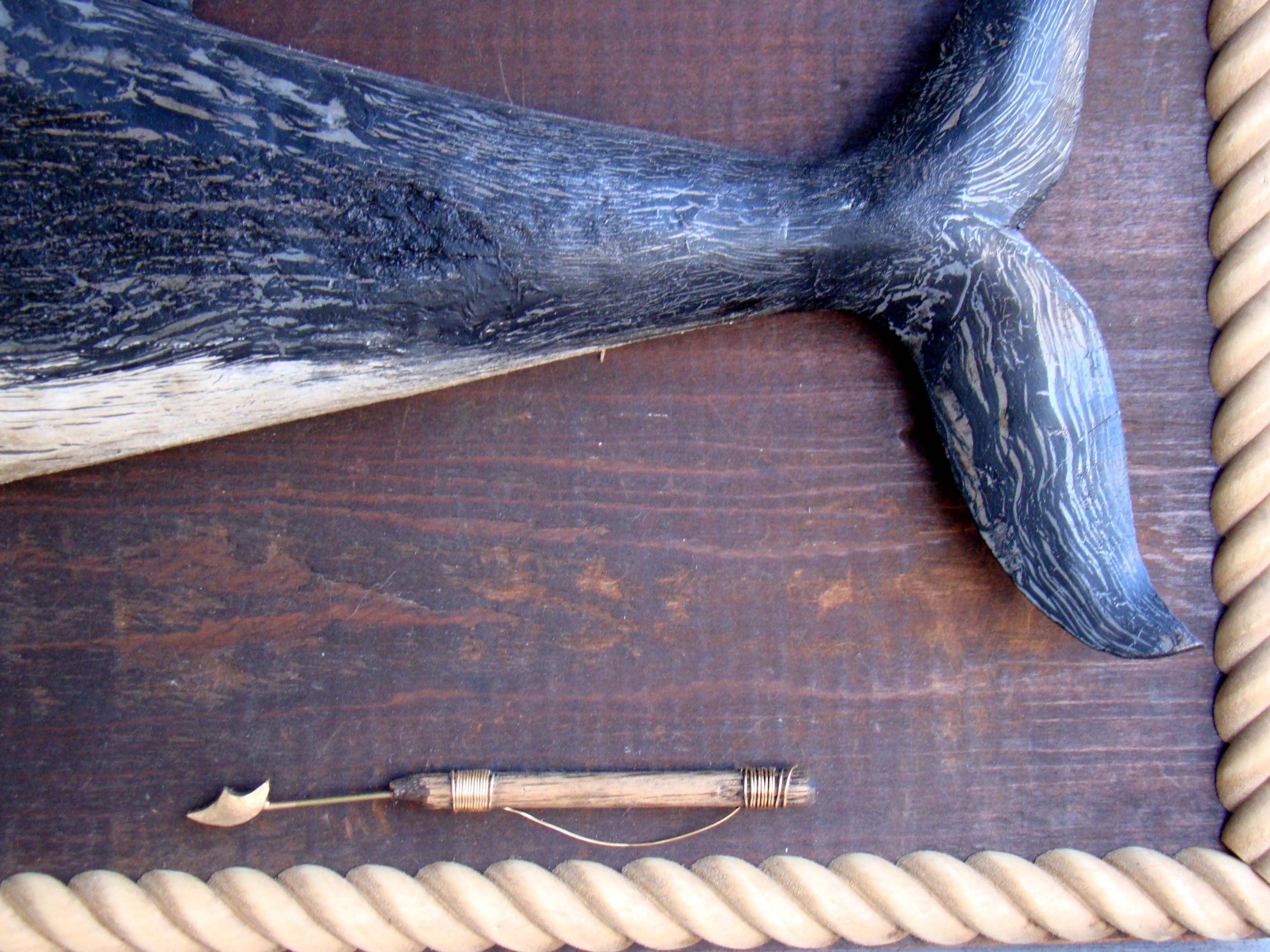 A wonderful vintage carved whale mounted on an antique backboard with rope border — image 3
