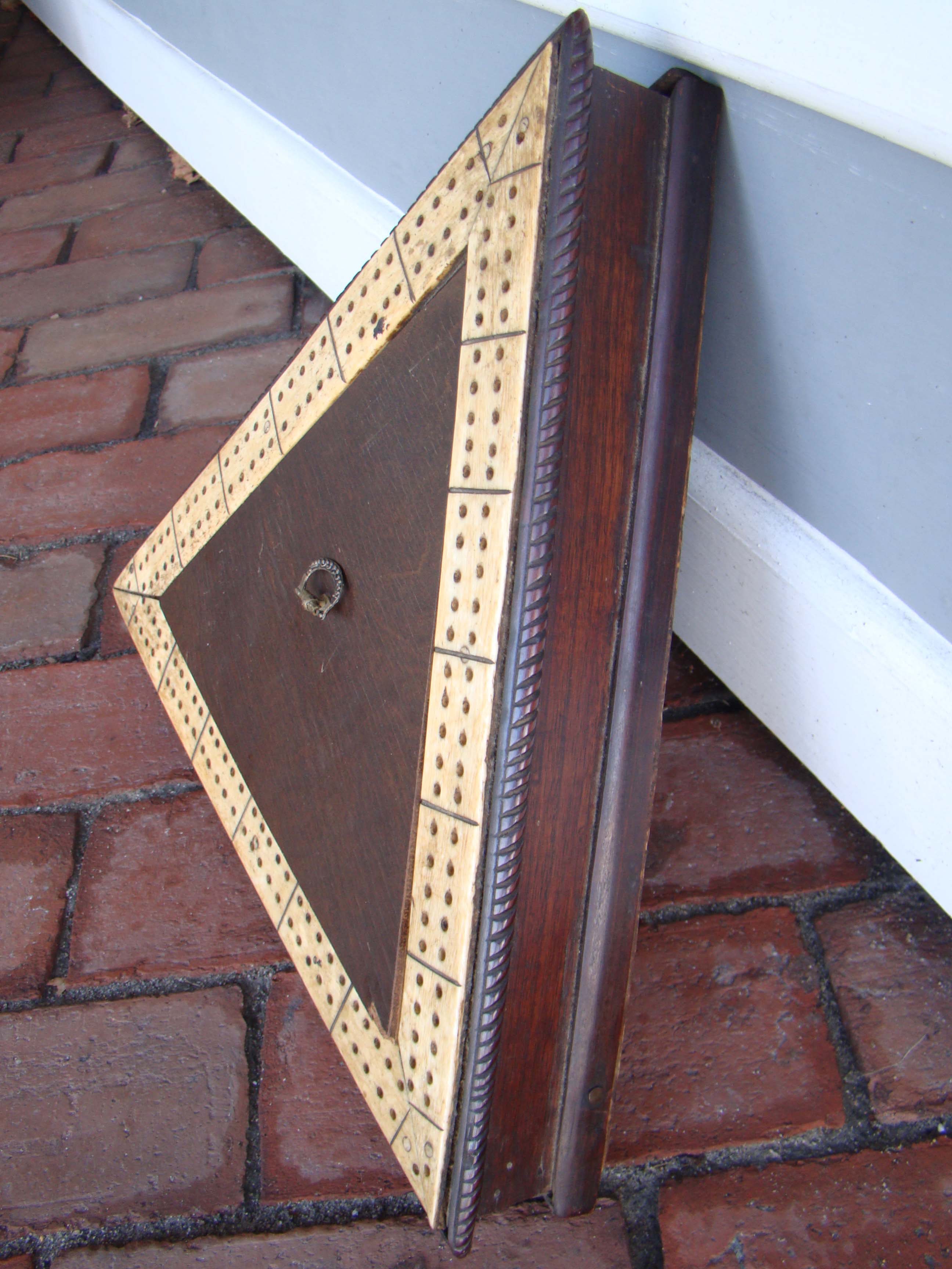 A rare sailor-made triangular whalebone cribbage board mounted on a mahogany base with rope twist border made circa 1830-1850 — image 2