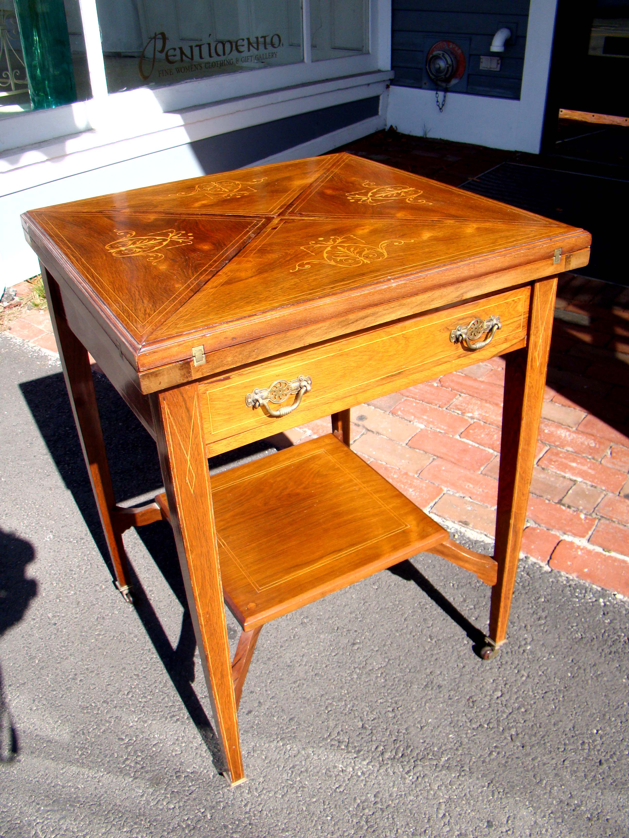 A fine 19th century rosewood fold-over games table inlaid with boxwood circa 1860-1870
