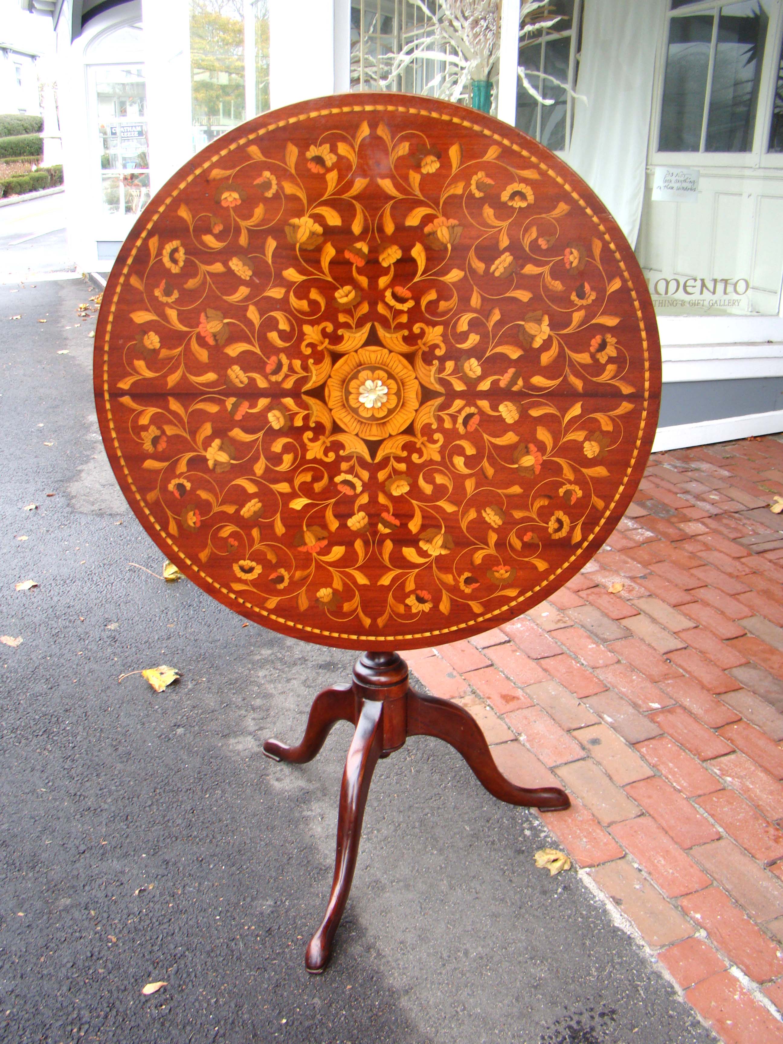 A wonderful 19th century American Queen Anne style tilt-top tea table with fabulous marquetry inlay 