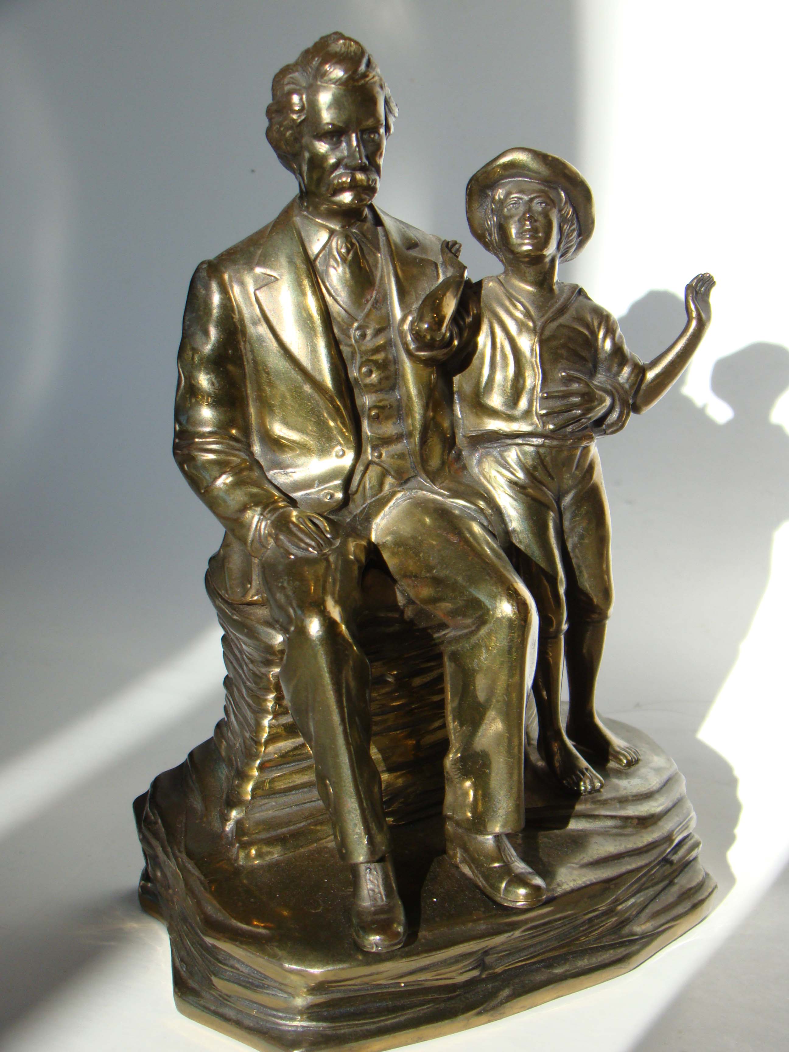 A fine and rare pair of vintage Mark Twain & Tom Sawyer bookends made by Jennings Brothers circa 1935-1940