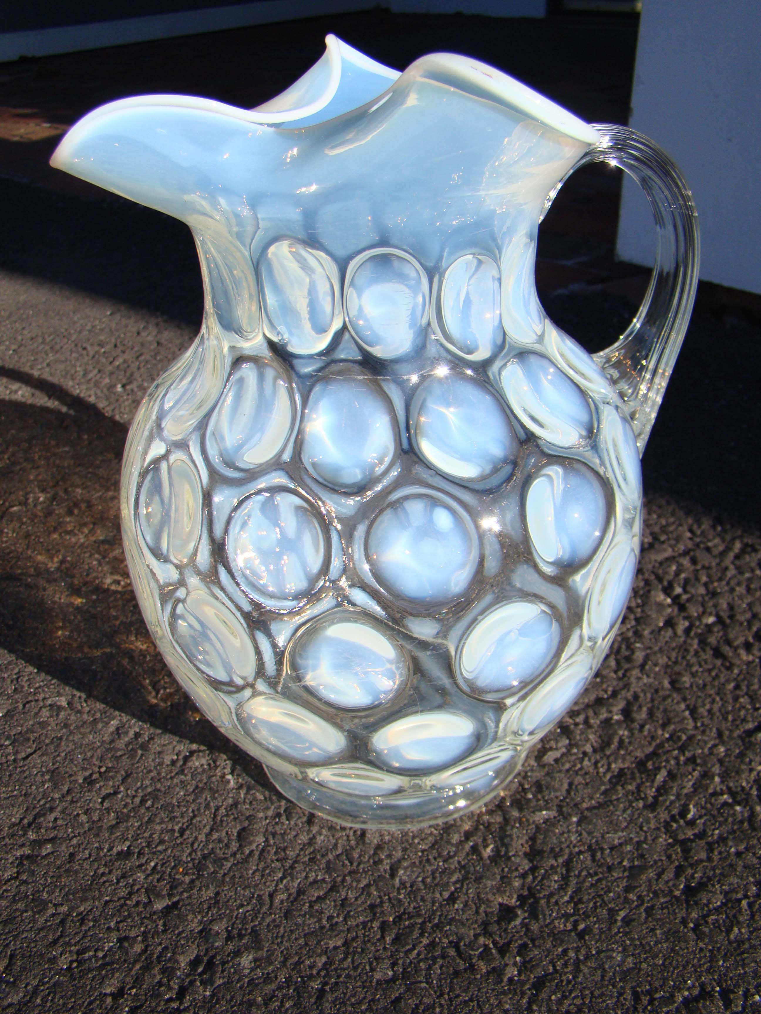 A large vintage Fenton coin dot pitcher