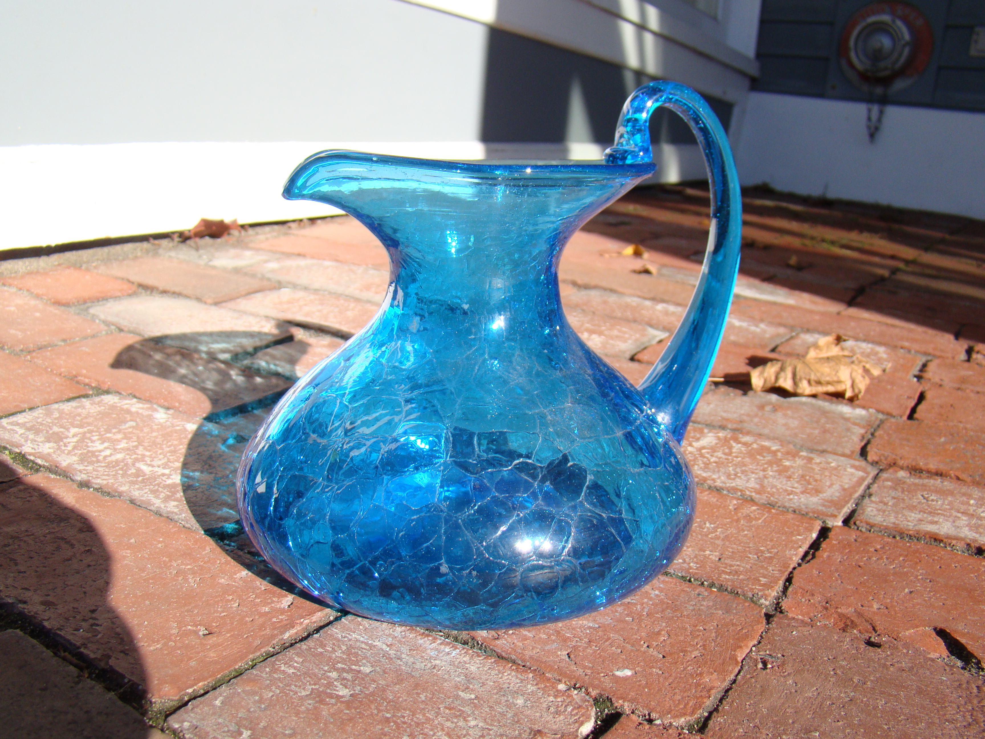 A fine vintage blue crackle glass decanter