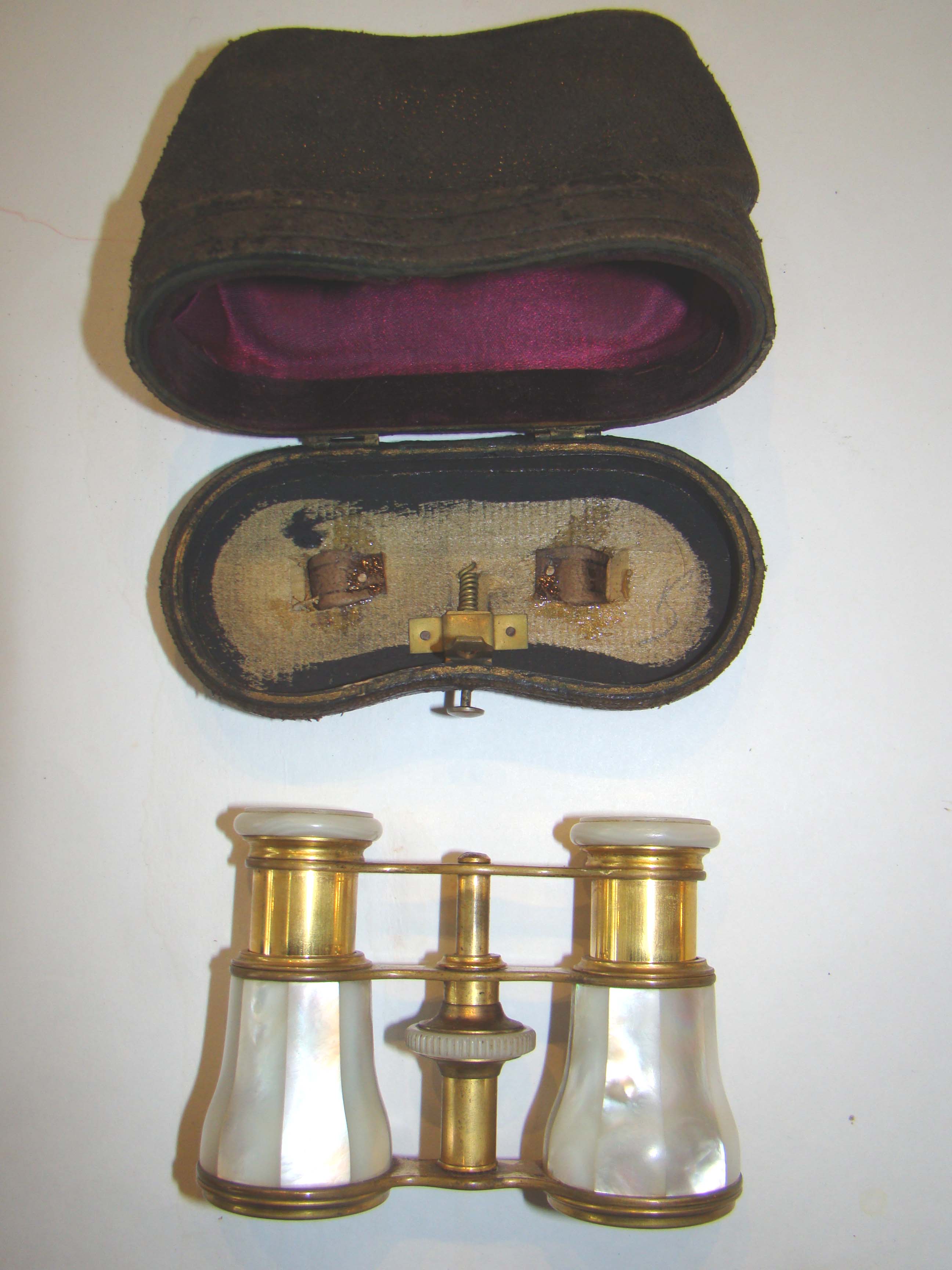 A pair of 19th century mother-of-pearl mounted gilt brass French opera glasses circa 1895