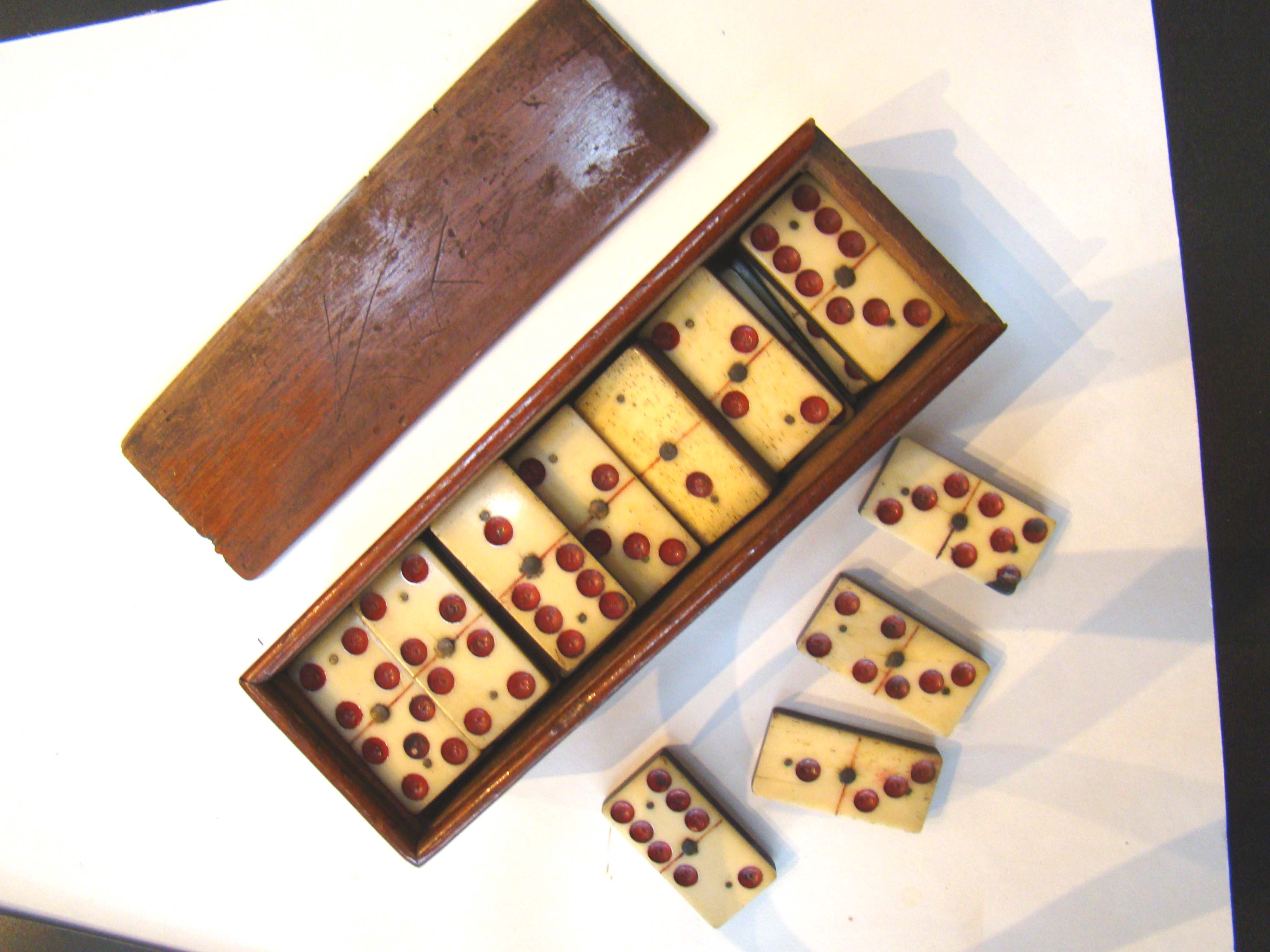 A very good and complete set of Civil War era bone and ebony dominoes having red dots — image 2