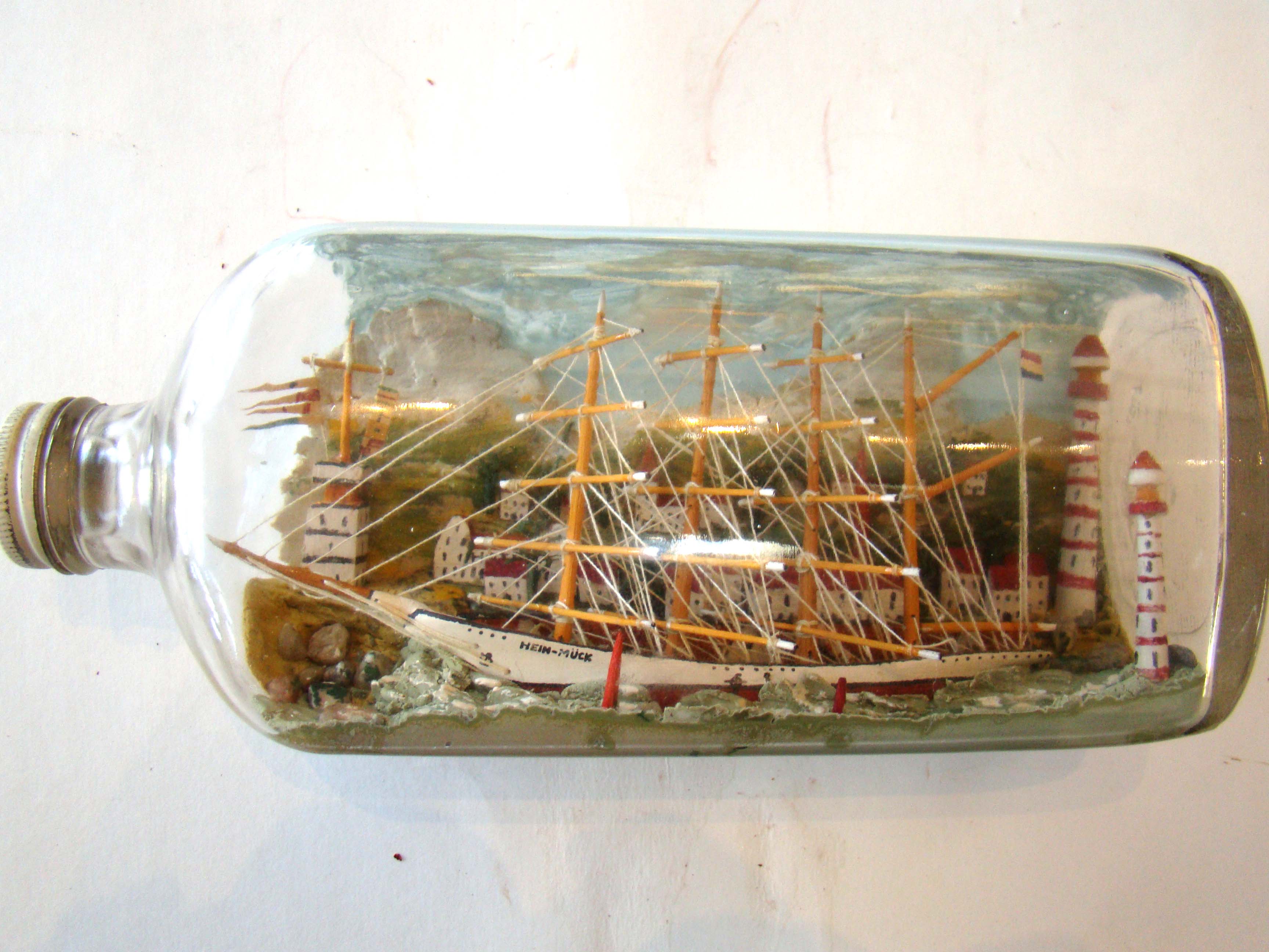 An absolutely fabulous vintage four masted ship-in-a bottle circa 1920