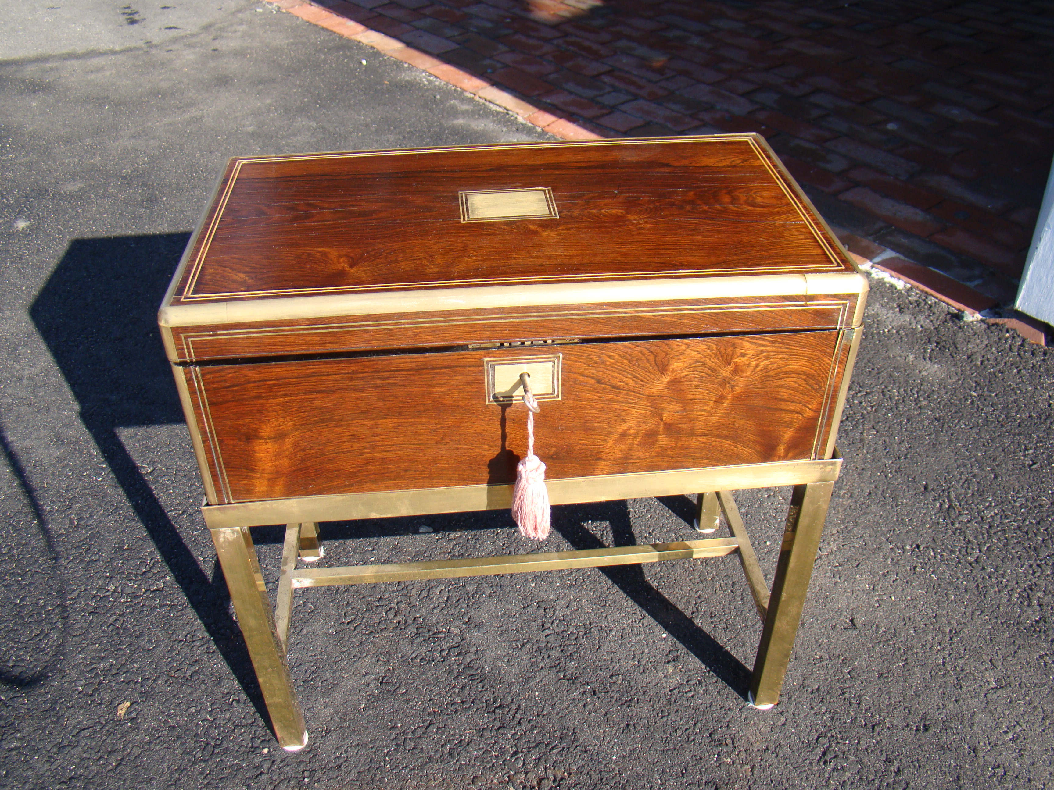 A nice 19th century brass mounted rosewood writing box circa 1830 on a custom made brass stand