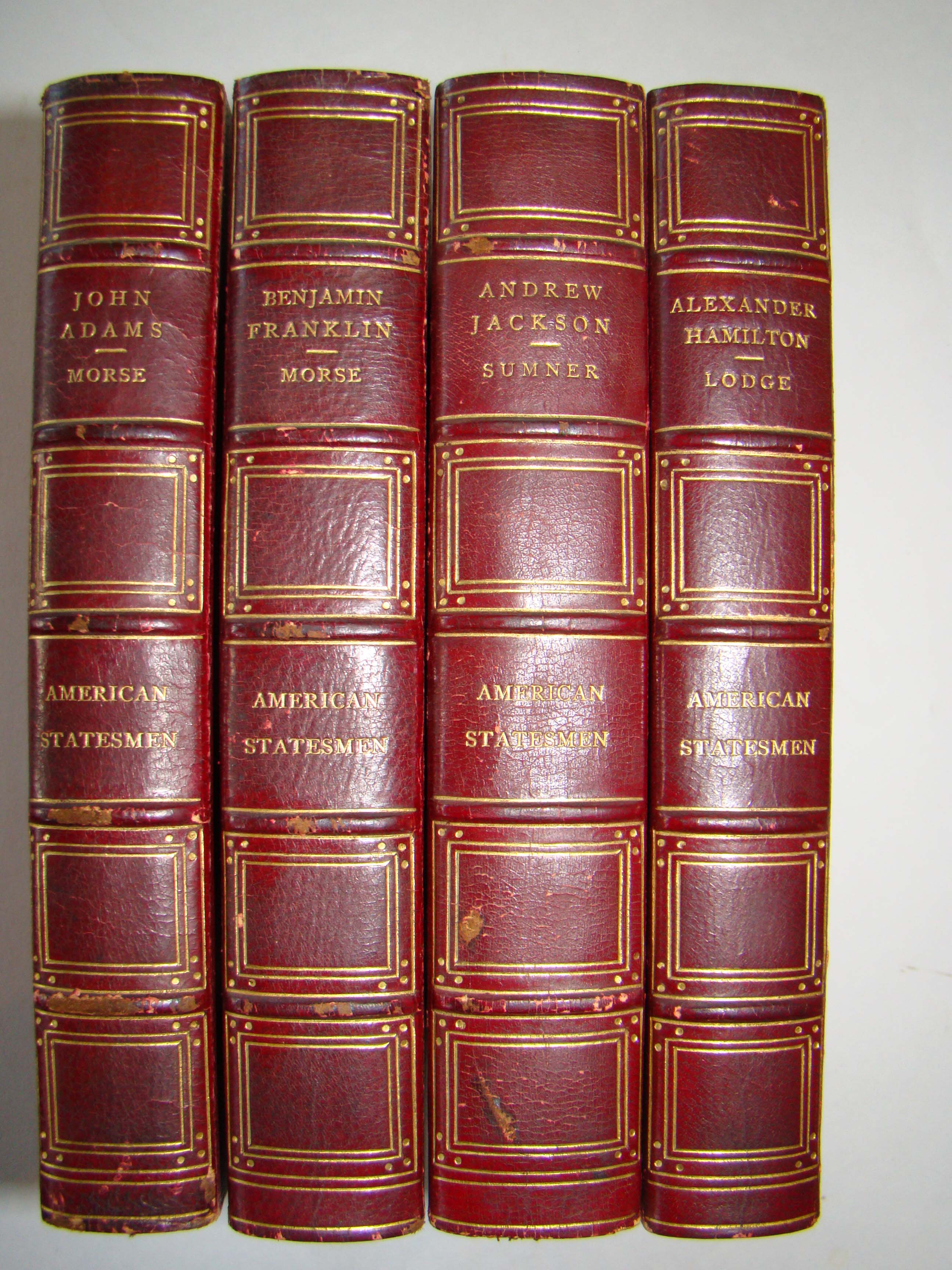 Four volumes of The American Statesman published between 1884-1898 featuring Ben Franklin, John Adams, Andrew Jackson and Alexander Hamilton