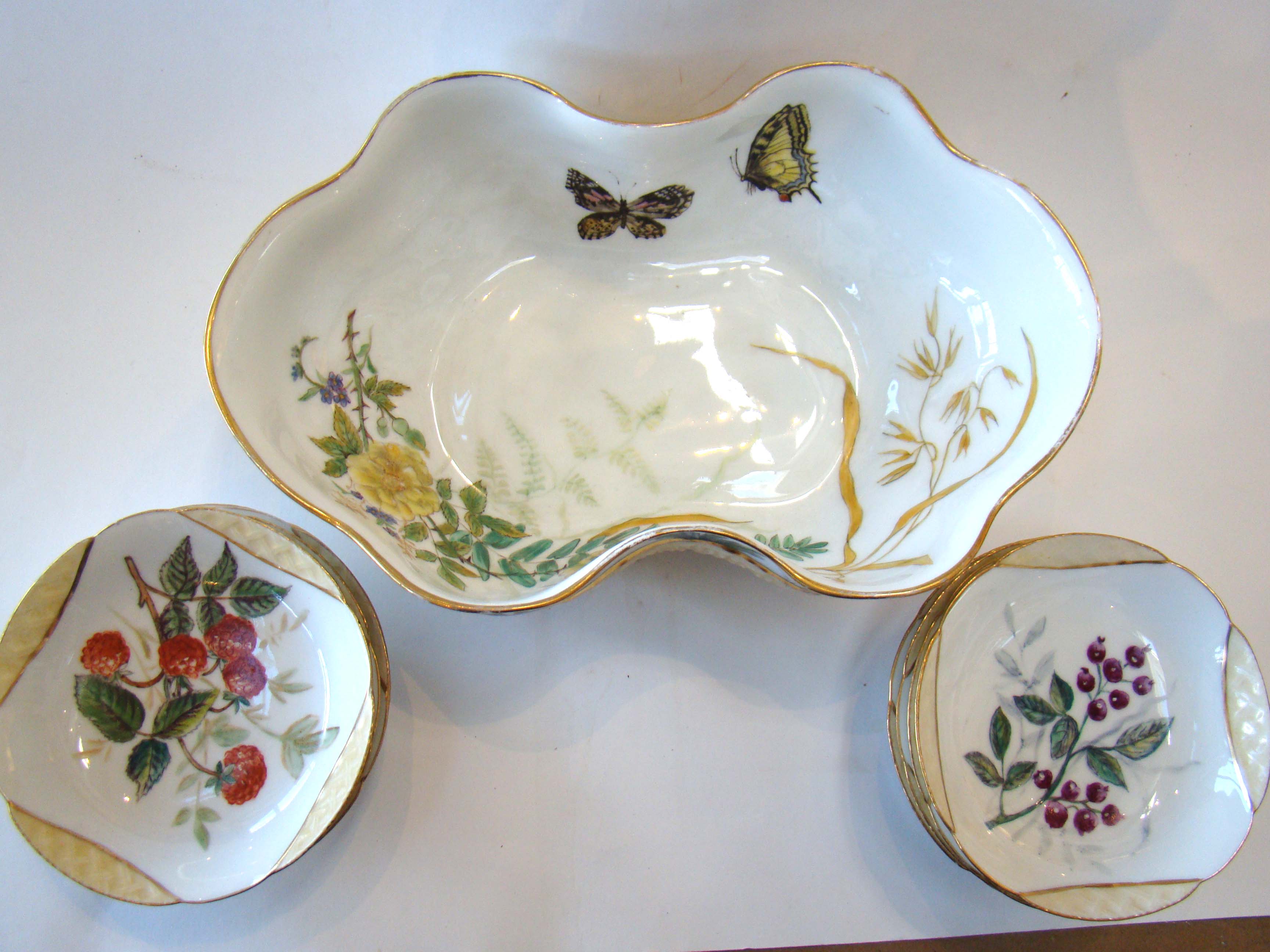 A gorgeous Limoges fruit basket with nine different hand painted fruit bowls circa 1880