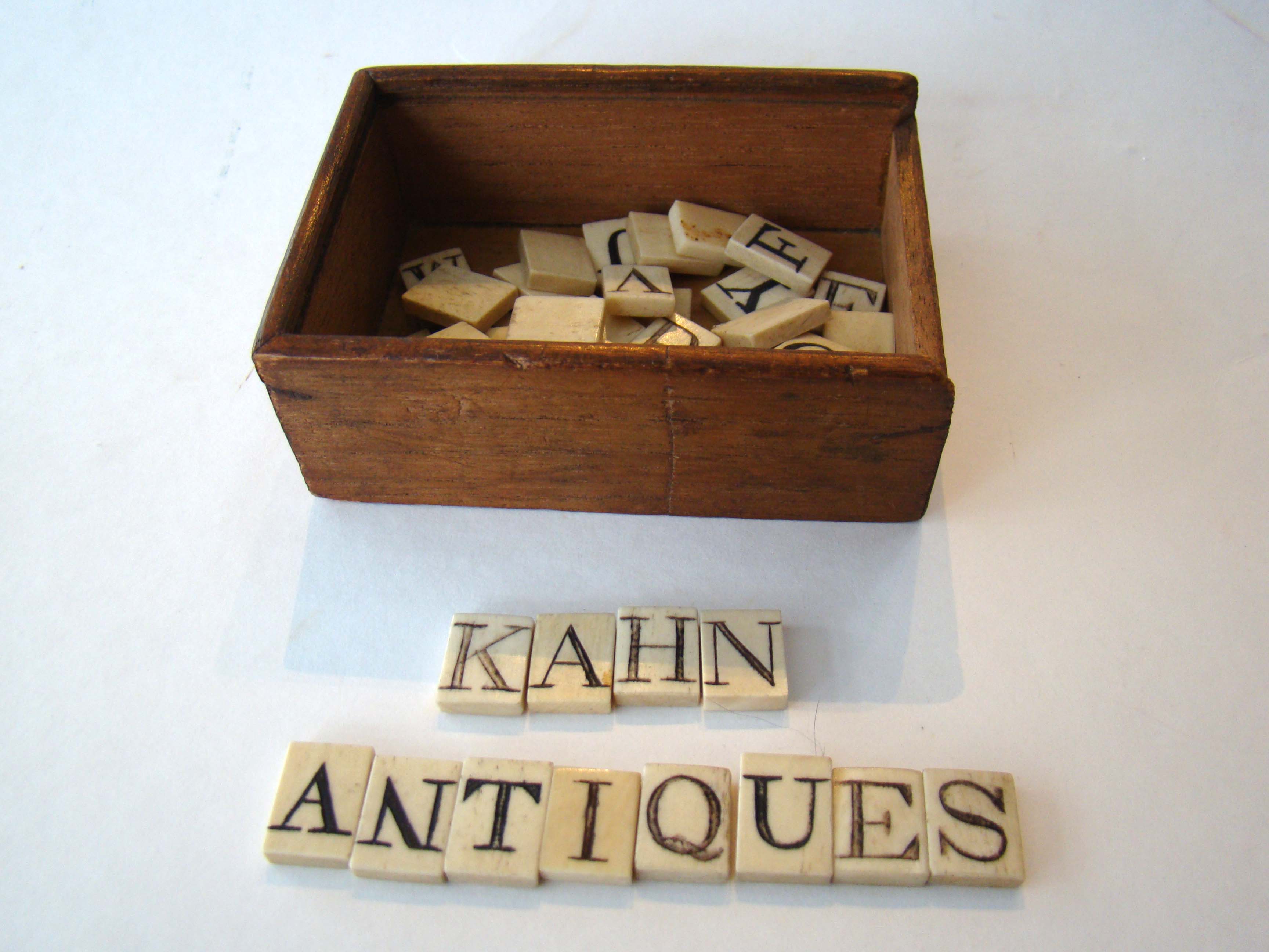 A box of 51 early 19th century whalebone ALPHABET tiles