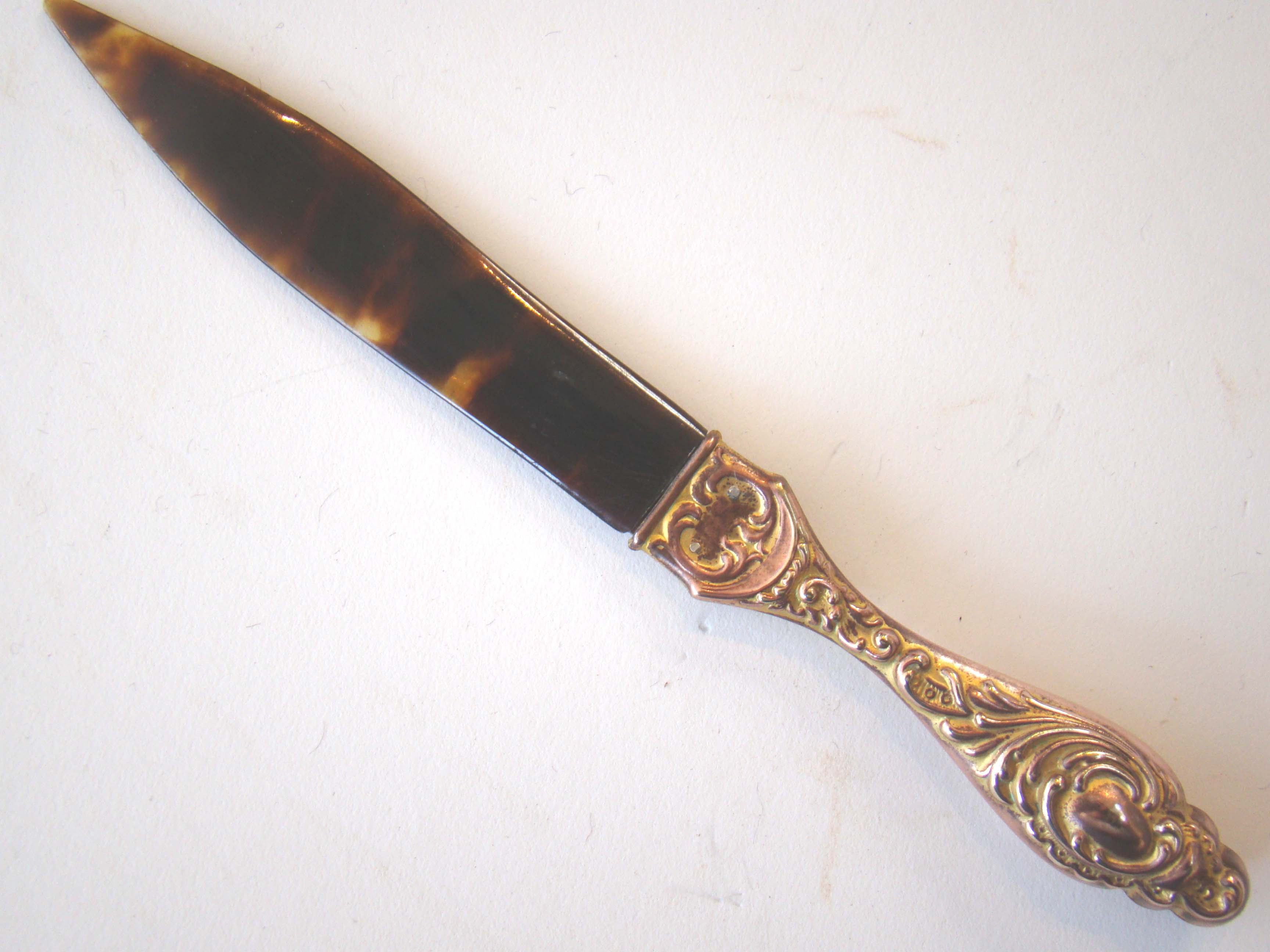 A wonderful late 19th century tortoiseshell mounted letter opener with beautiful gilt handle