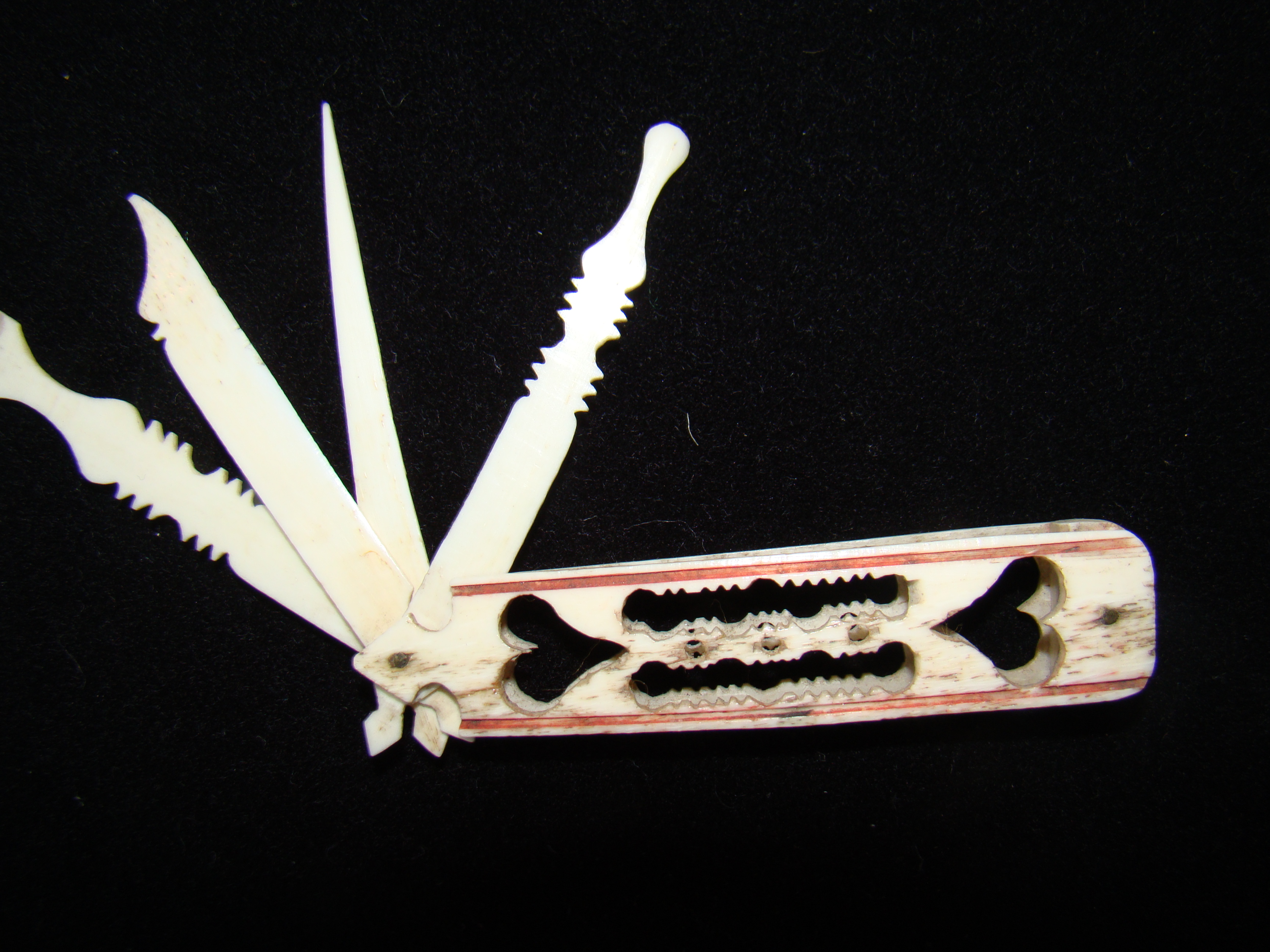 A fine 19th century carved whalebone folding pocket implement case circa 1850