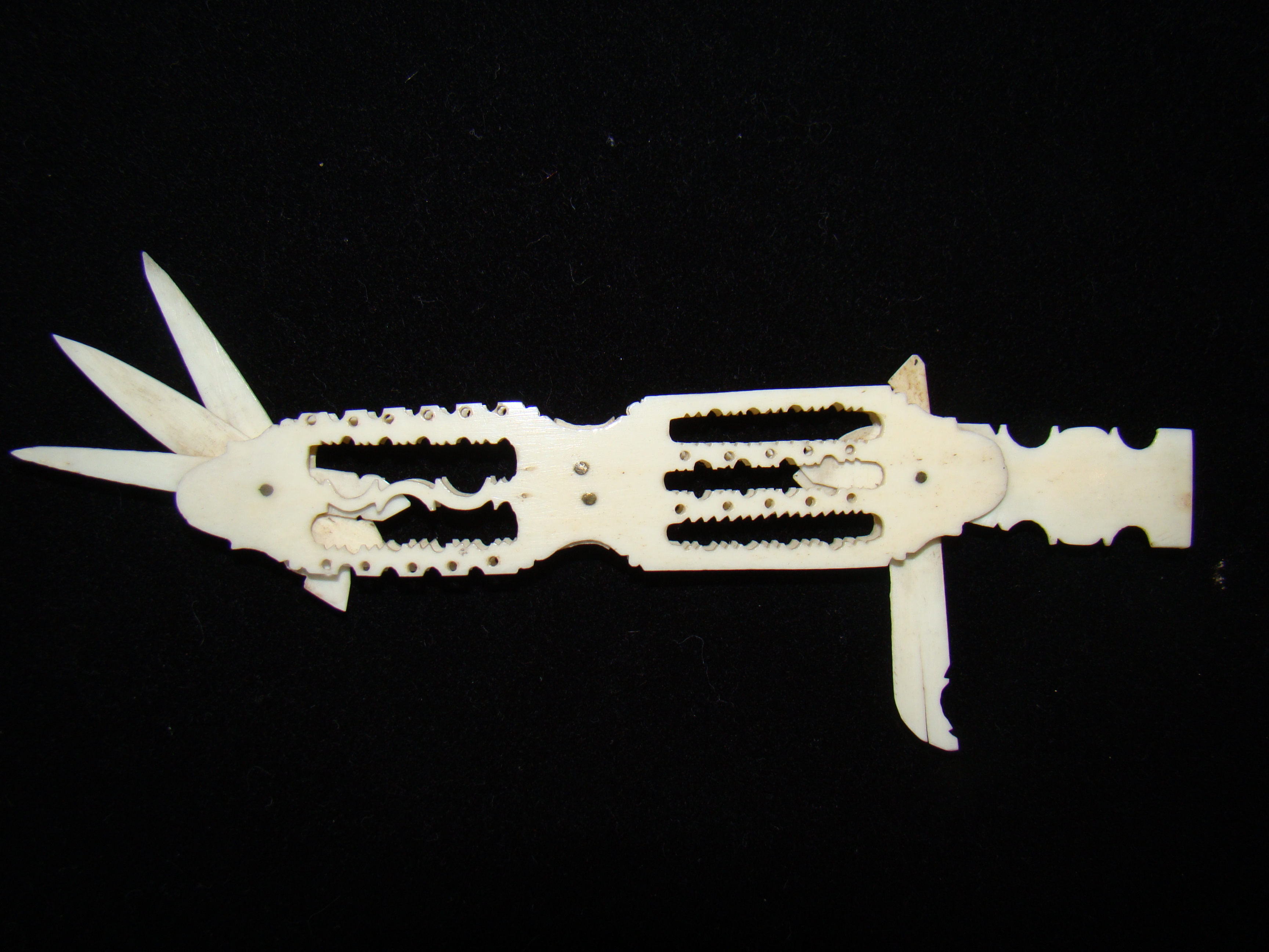 A large 19th century whalebone folding implement case having five implements circa 1840
