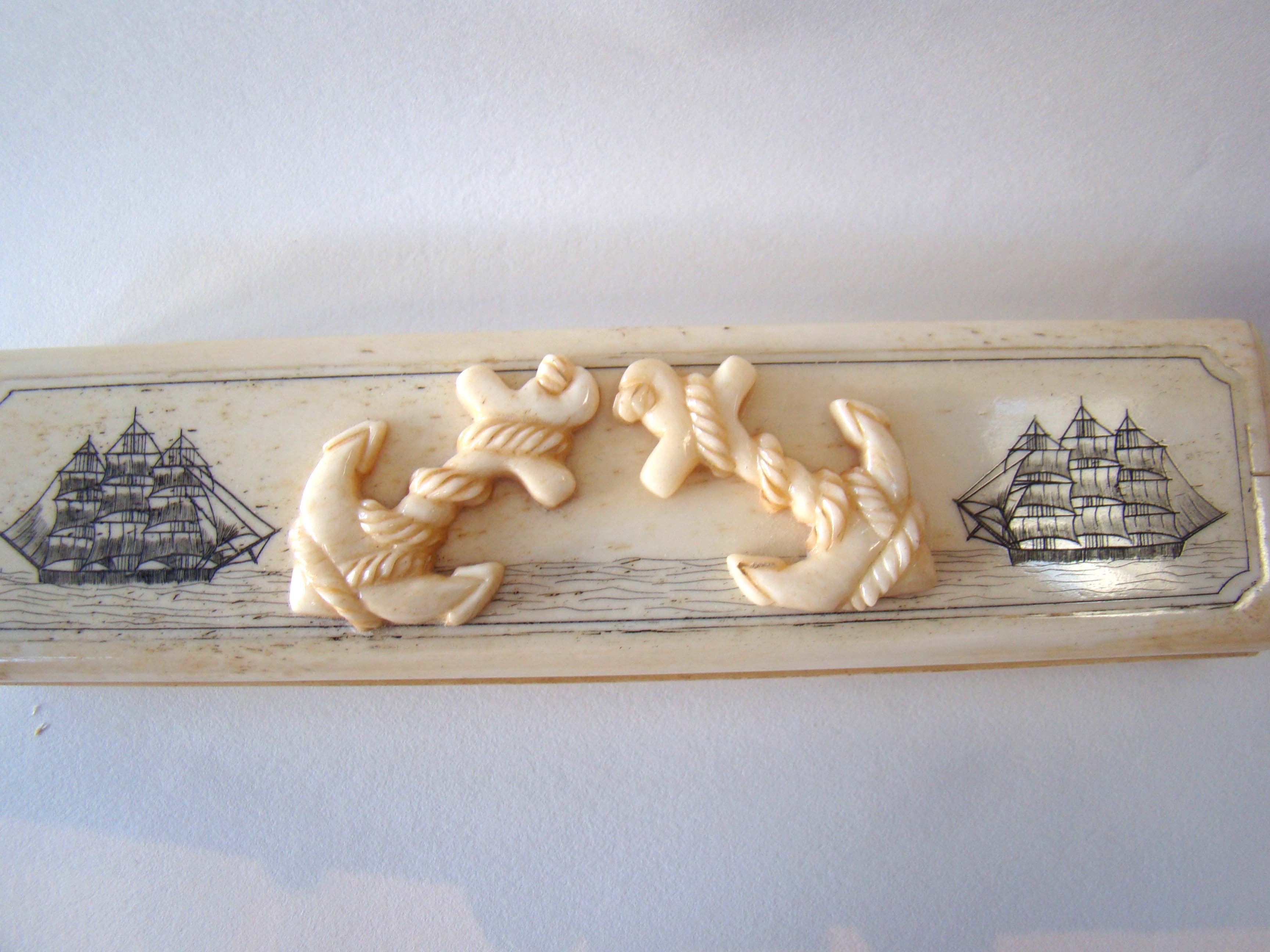 A lovely whalebone box having two anchors and two ships on the lid. 20th century