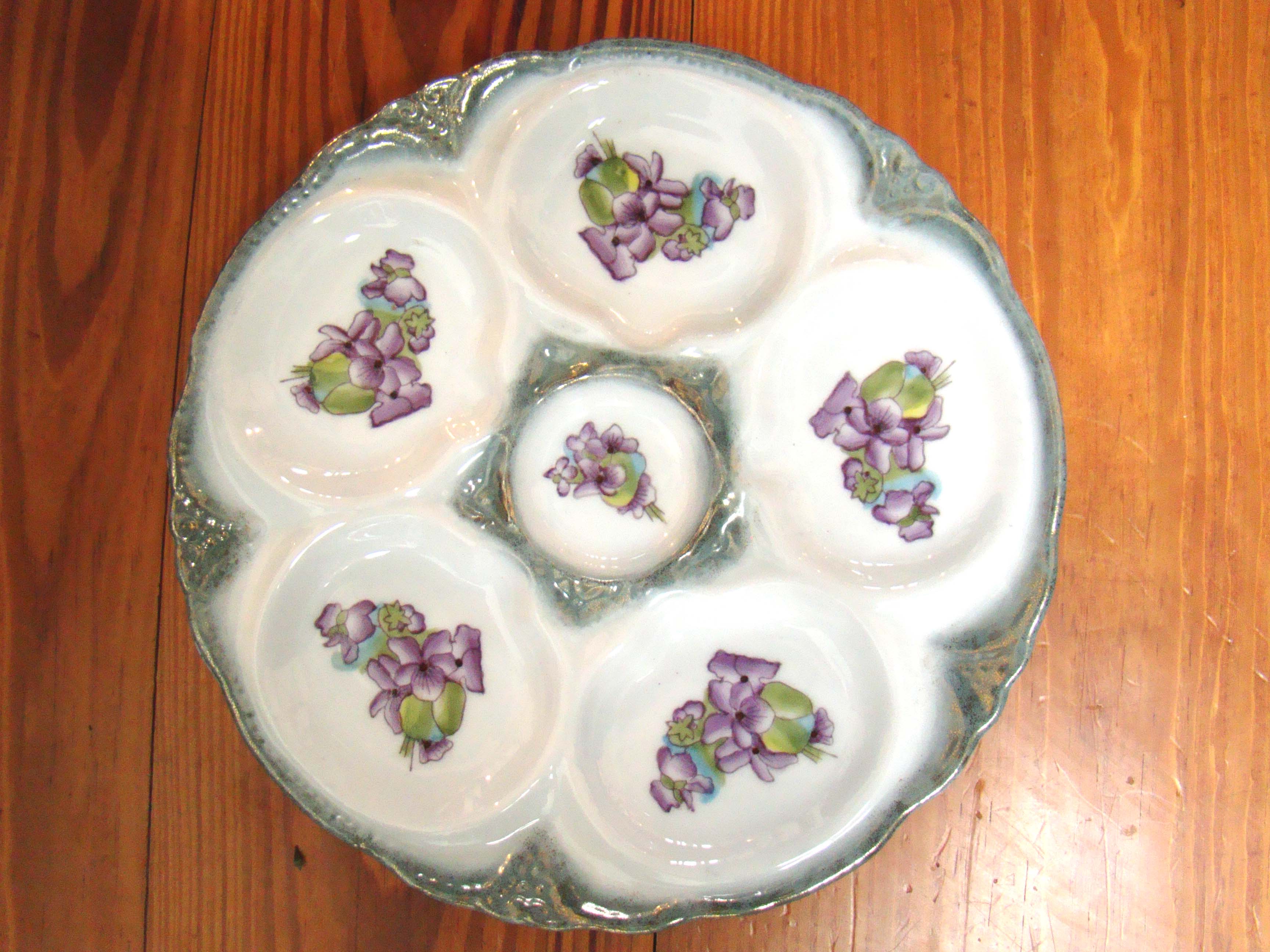 A beautiful vintage Limoges oyster plate in the violet pattern circa 1900