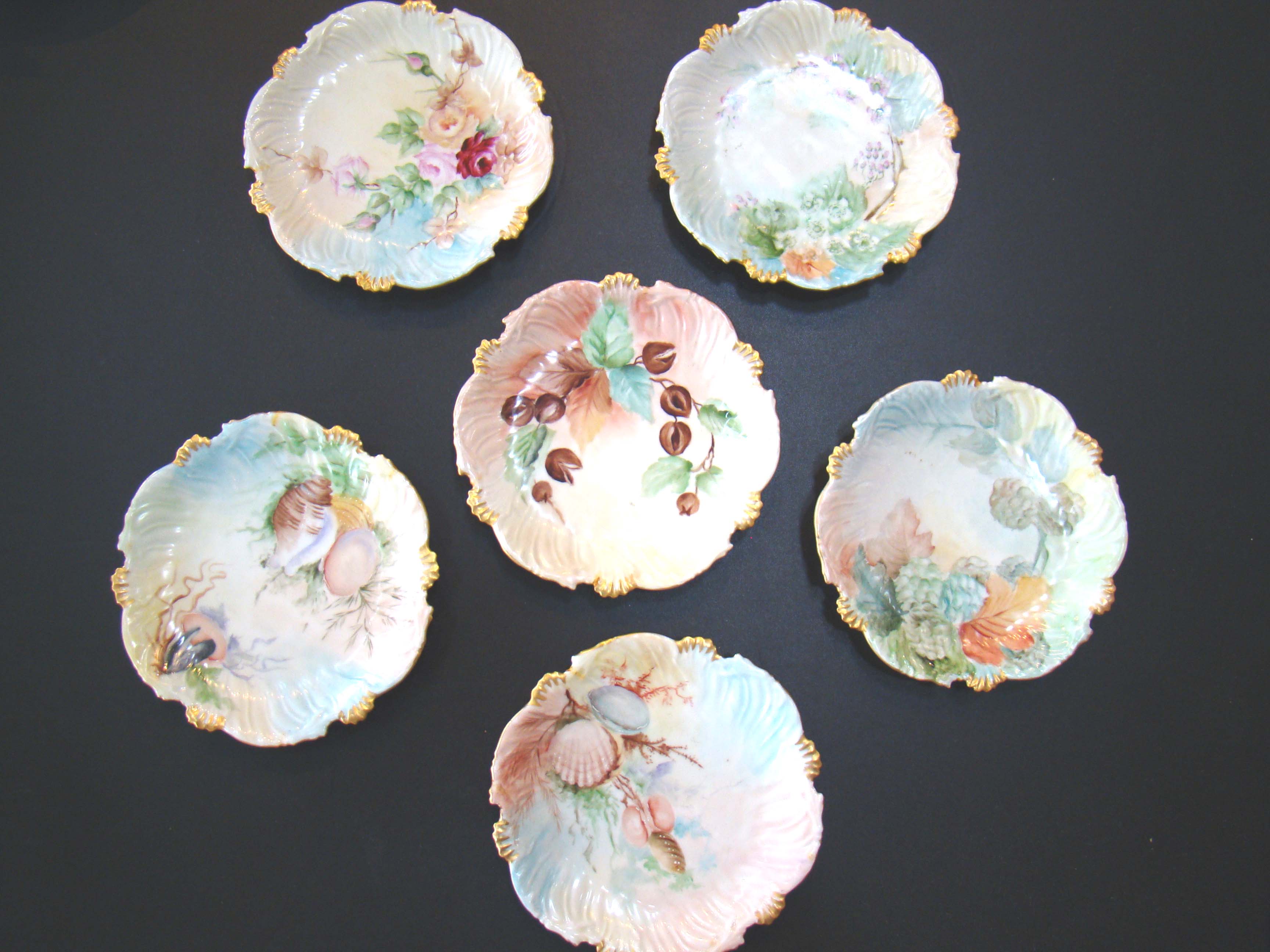 A set of six vintage hand painted seascape pattern Limoges side plates made by Tressemann & Vogt circa 1890