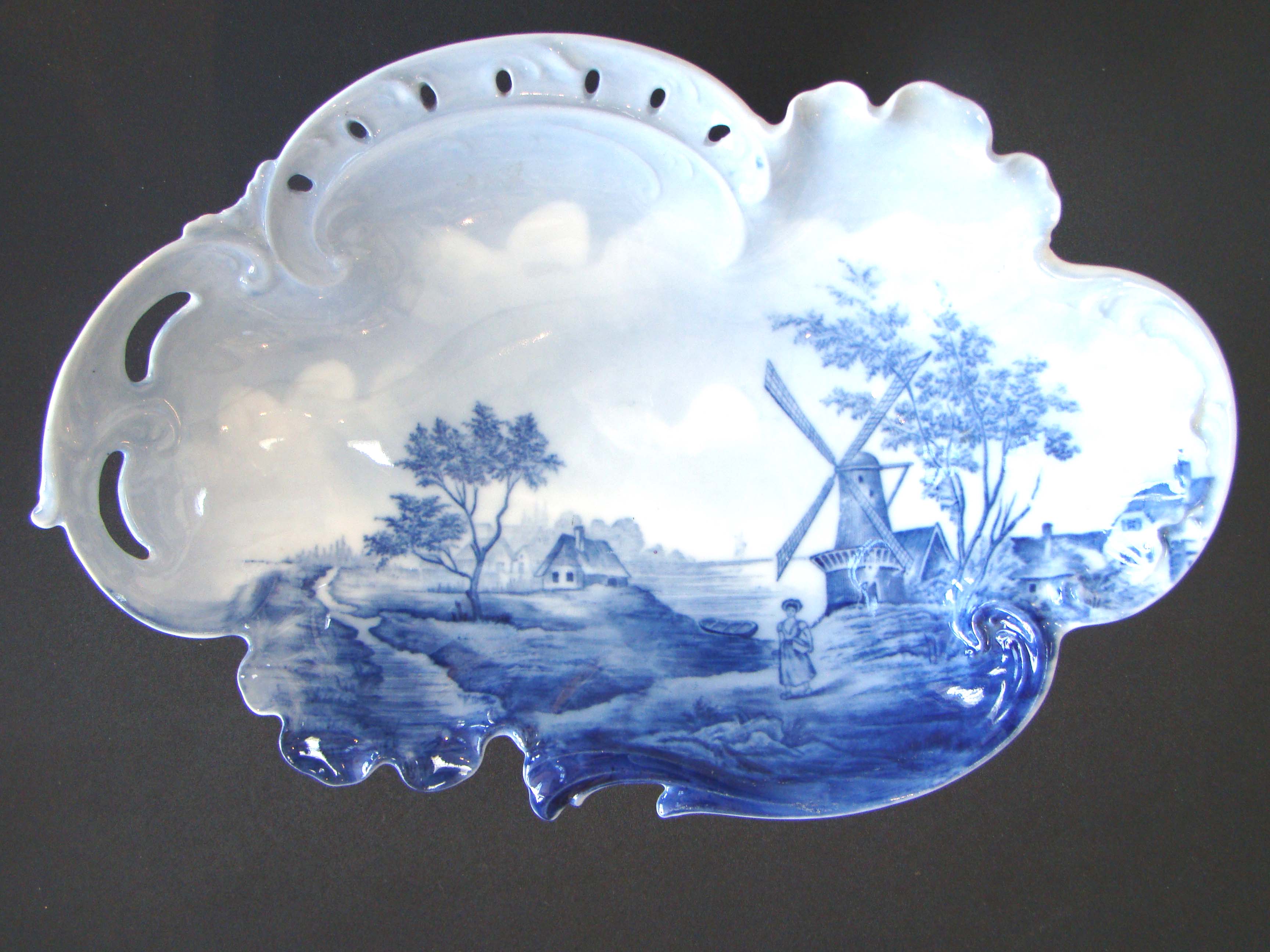 A beautiful vintage hand painted Dutch Delft shaped and reticulated serving bowl