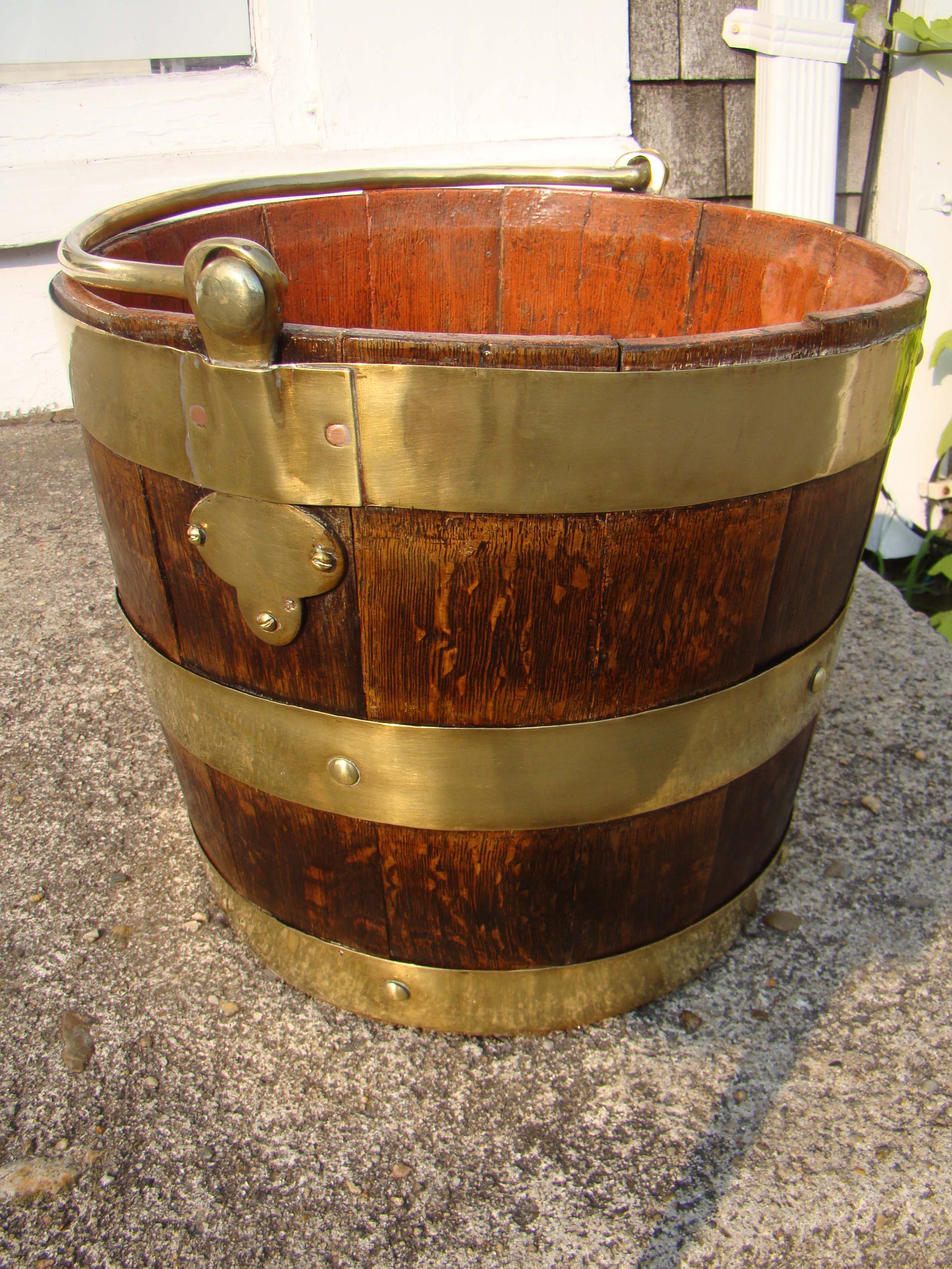 A fine ships' brass mounted oak bucket circa 1780