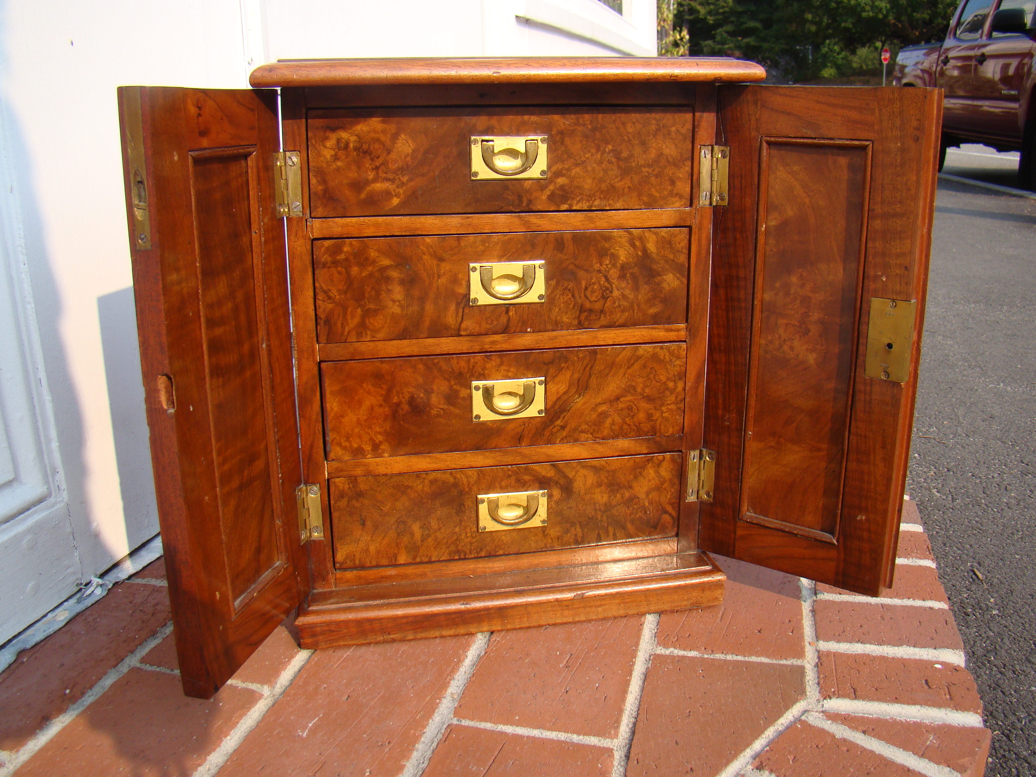 A gorgeous early 19th century burled walnut Campaign cabinet with four drawers circa 1830