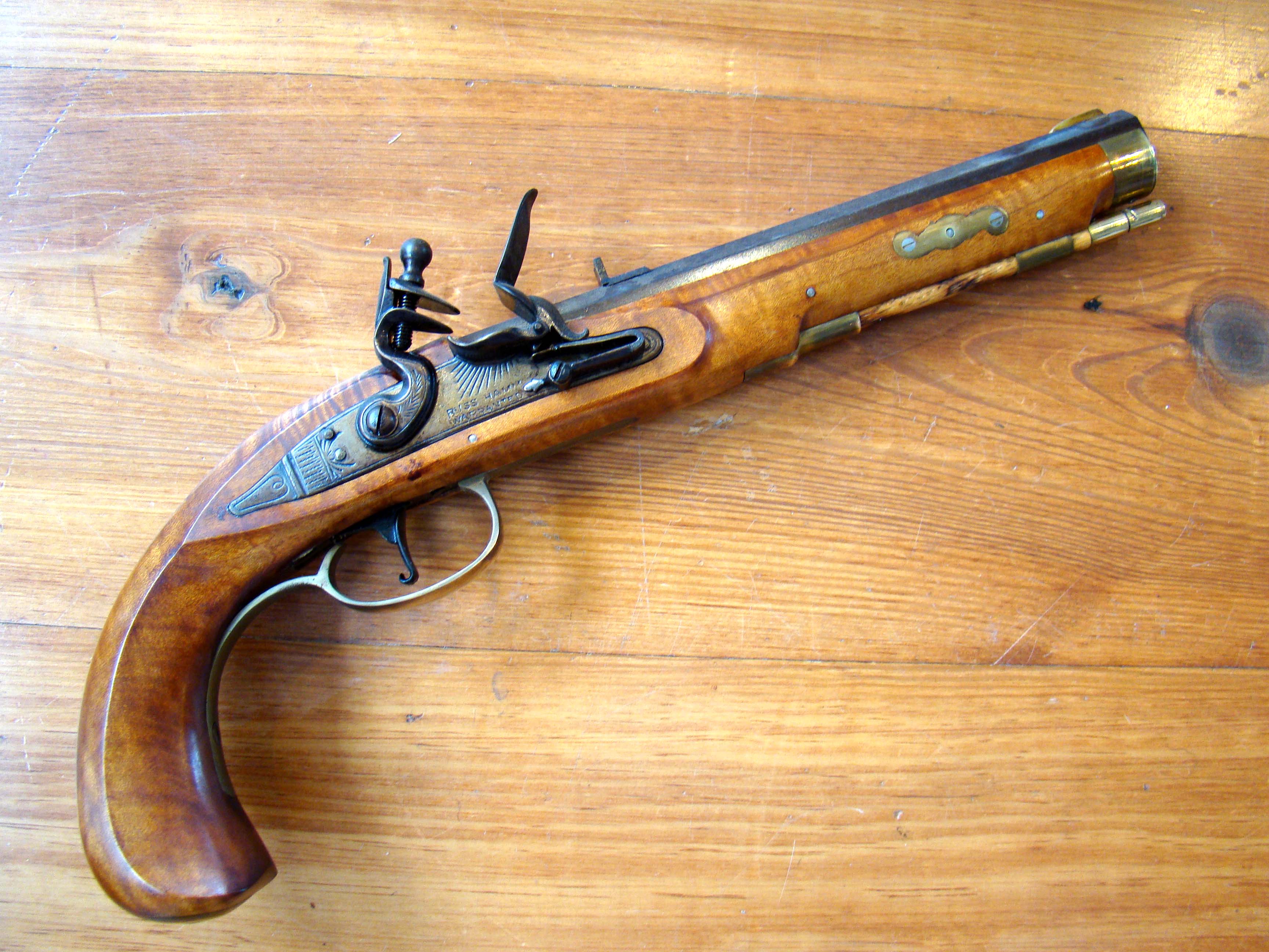 A fine vintage Kentucky 'style' flintlock pistol in tiger maple with lockplate signed "Russ Hamm Warranted"