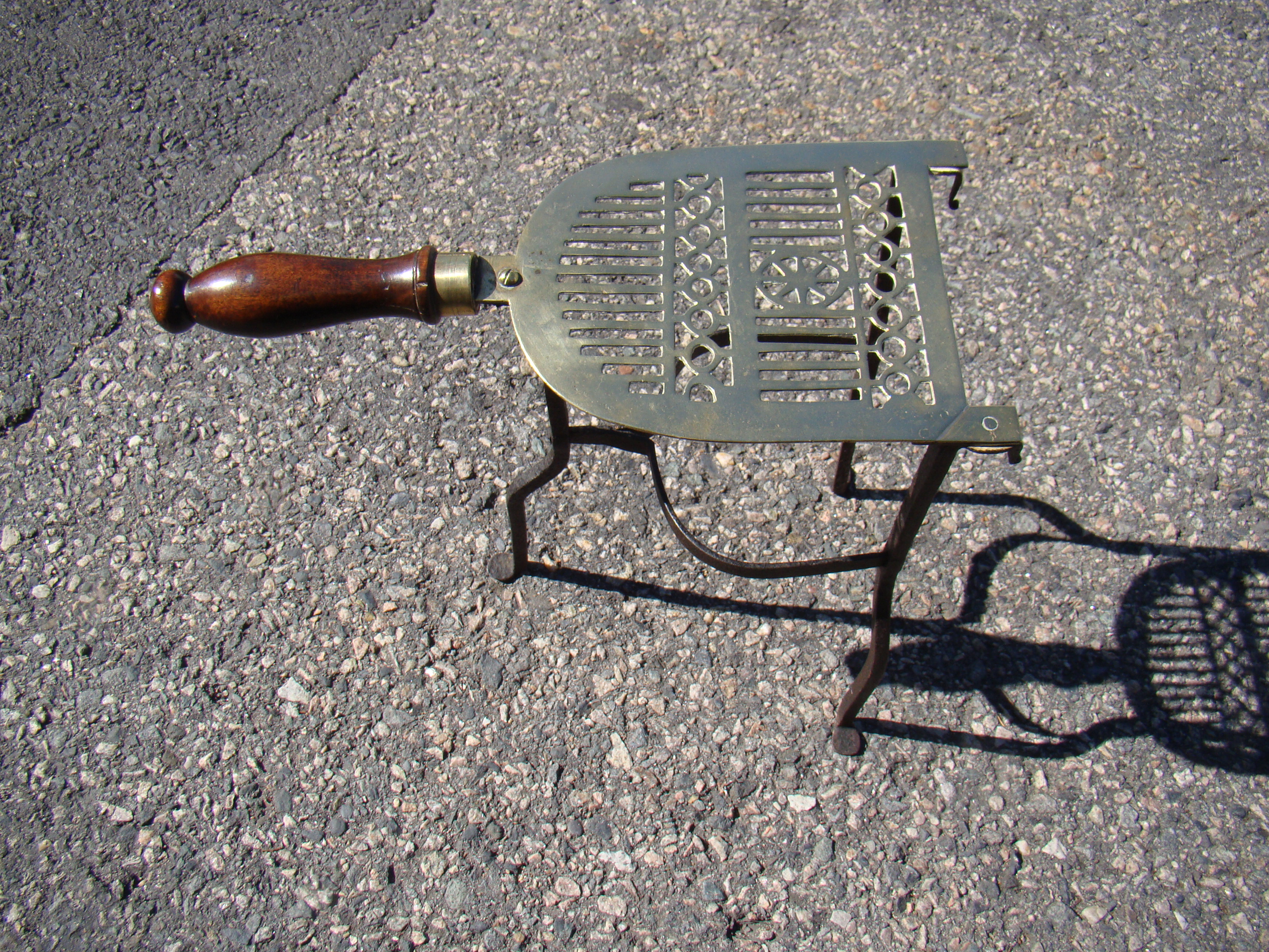 A fine antique English brass & iron pierced 'penny foot' trivet circa 1800