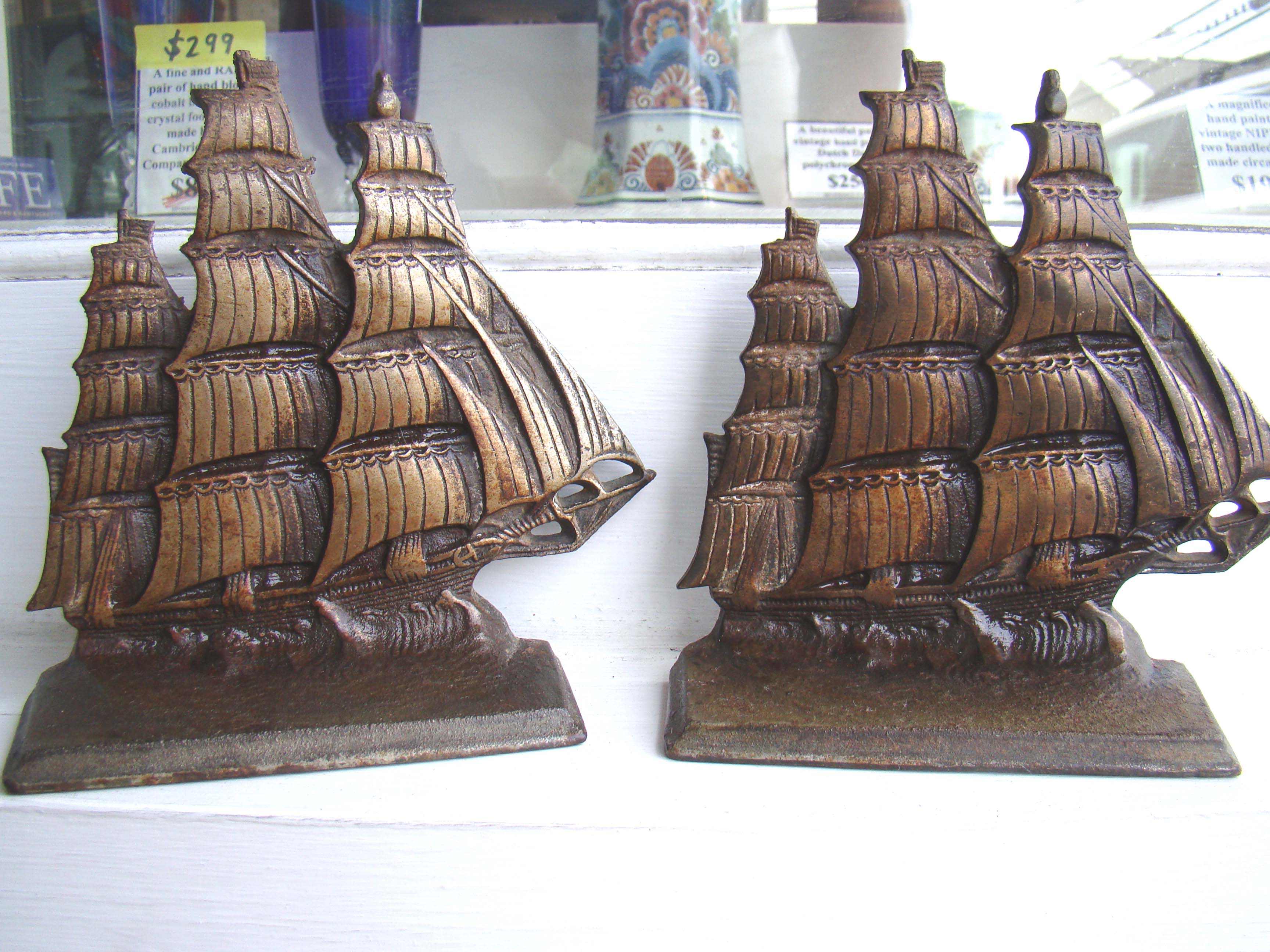 A pair of vintage cast brass clipper ship bookends circa 1920